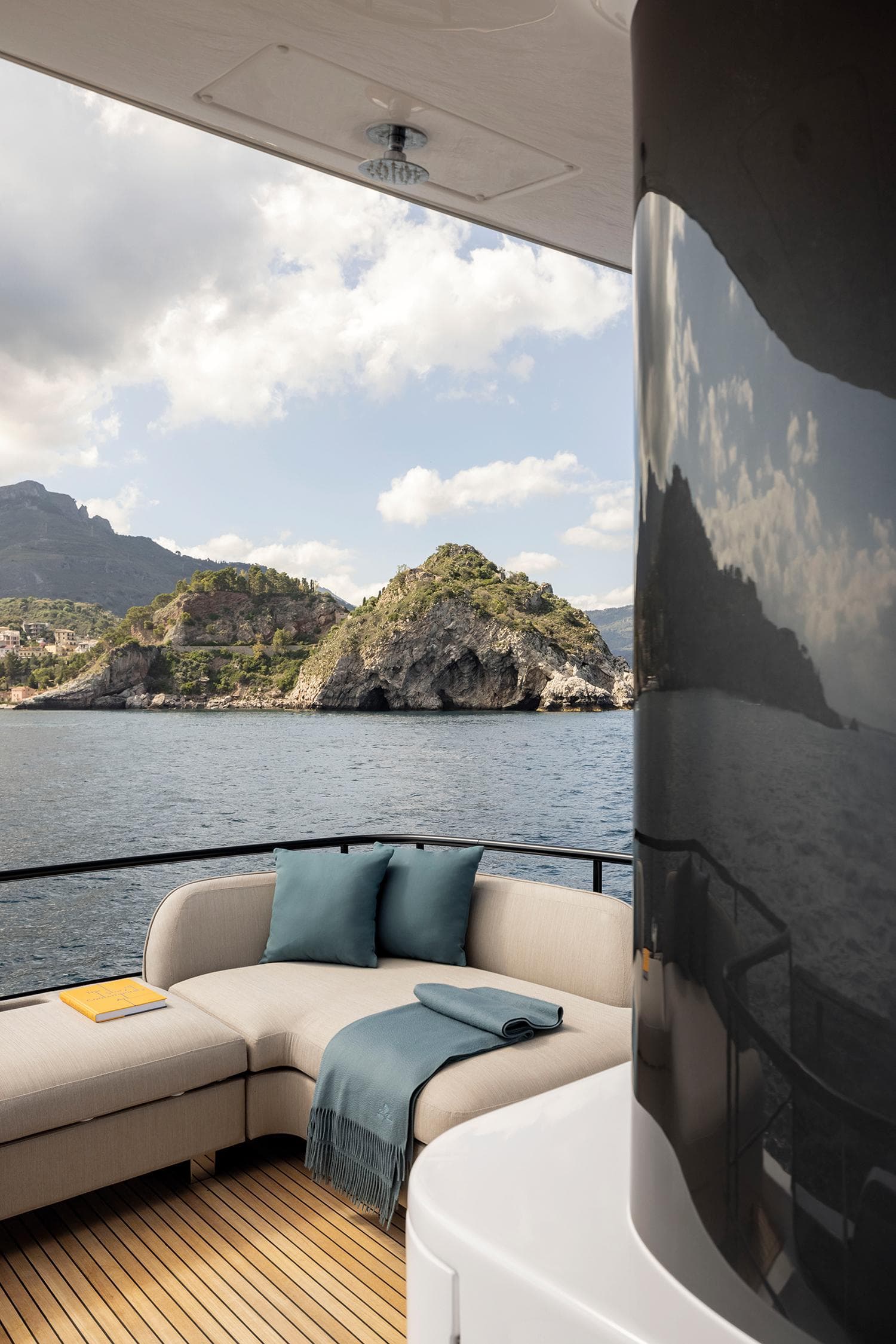 Luxurious Azimut Magellano 60 yacht deck with scenic ocean view, 2025 model.