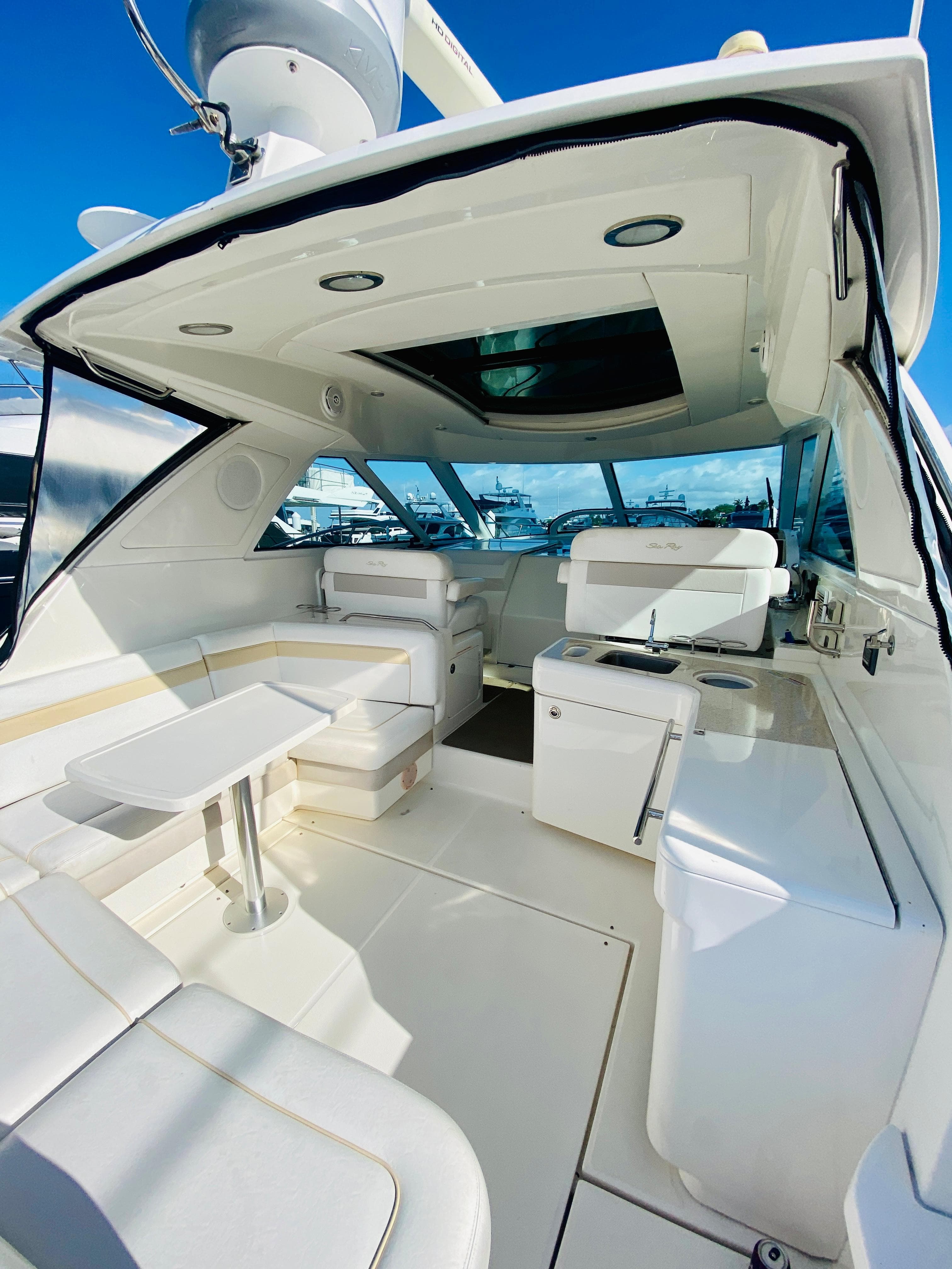 2010 Sea Ray 450 Sundancer yacht interior with seating and table.