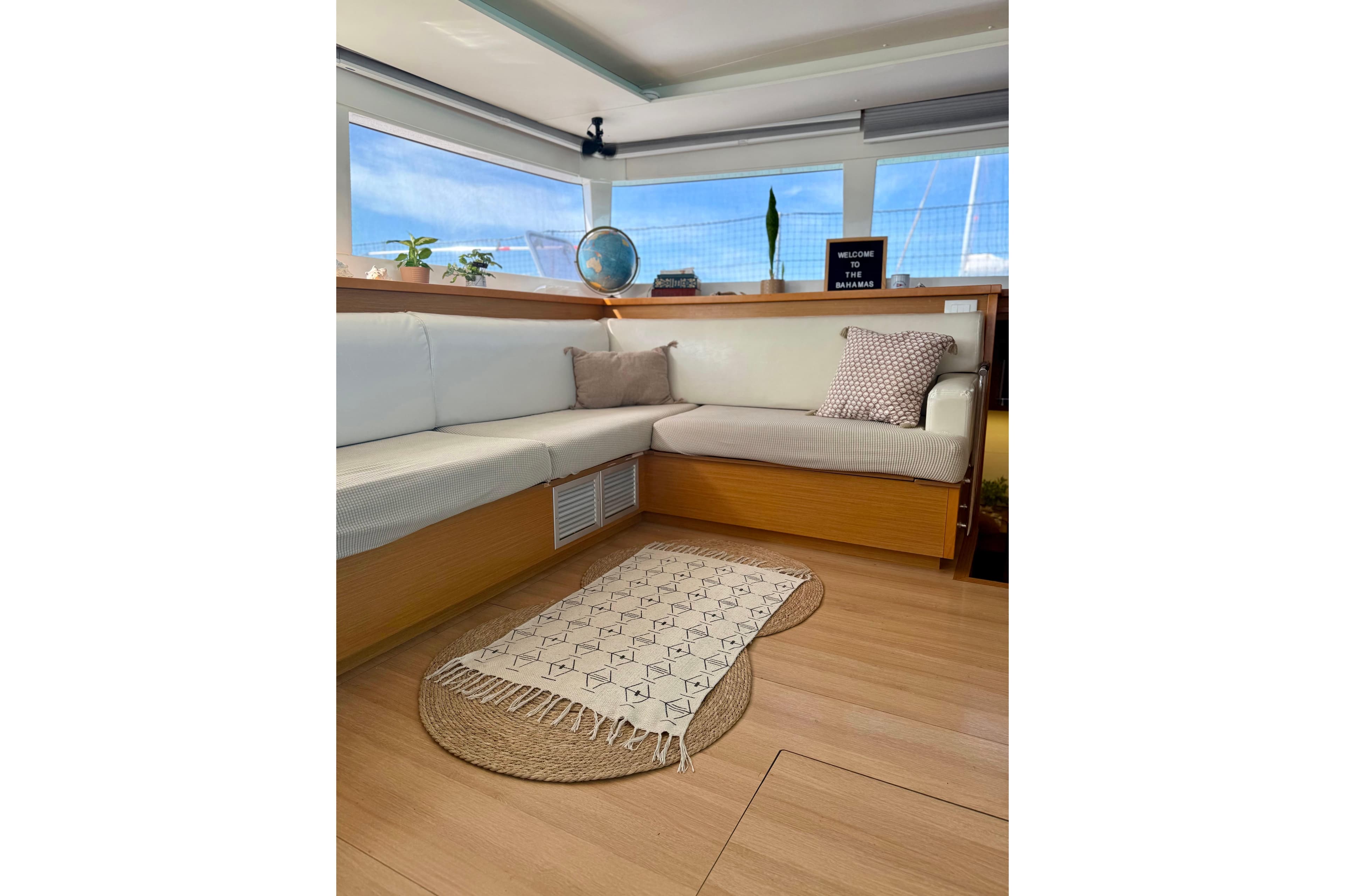 Interior of 2016 Lagoon 450 F catamaran with cozy seating and decorative accents.