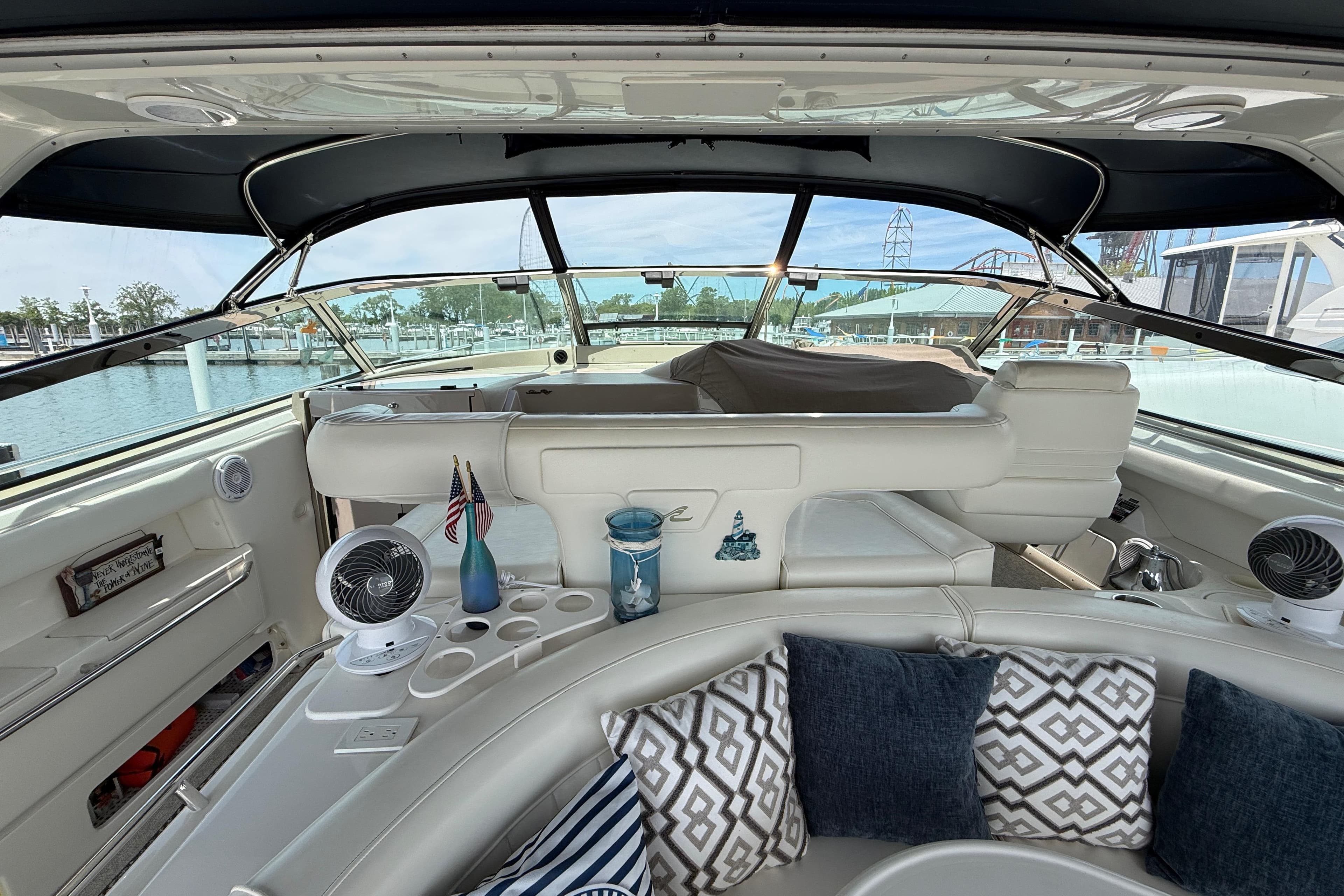 Interior view of a 1998 Sea Ray 500 Sundancer yacht with plush seating and nautical decor.