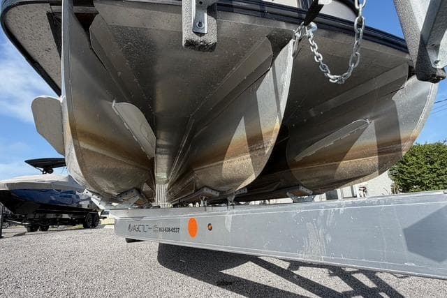 2023 Barletta L23U pontoon boat on a trailer, underside view.
