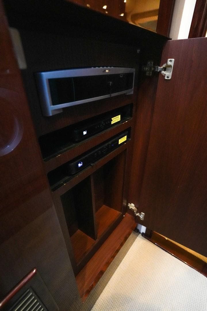2013 Sea Ray 610 Sundancer interior cabinet with electronic equipment.