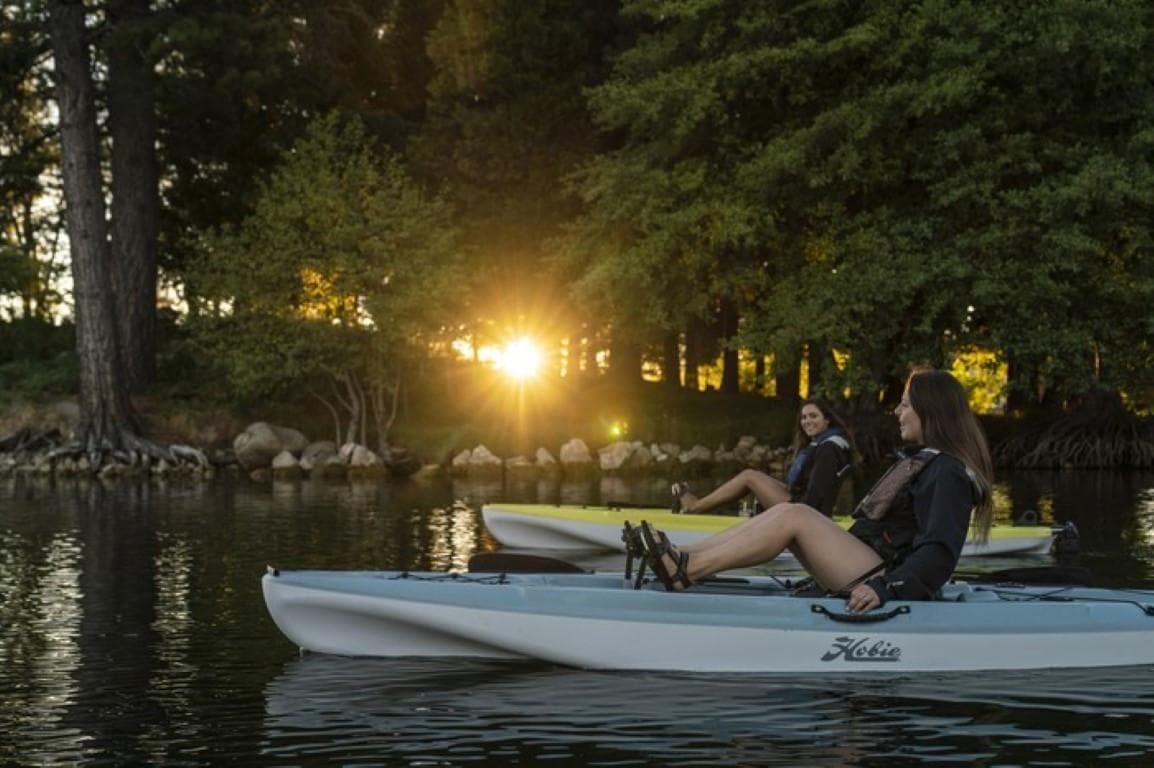 Two people kayaking on a lake at sunset in 2022 Hobie Mirage Passport 12.0.