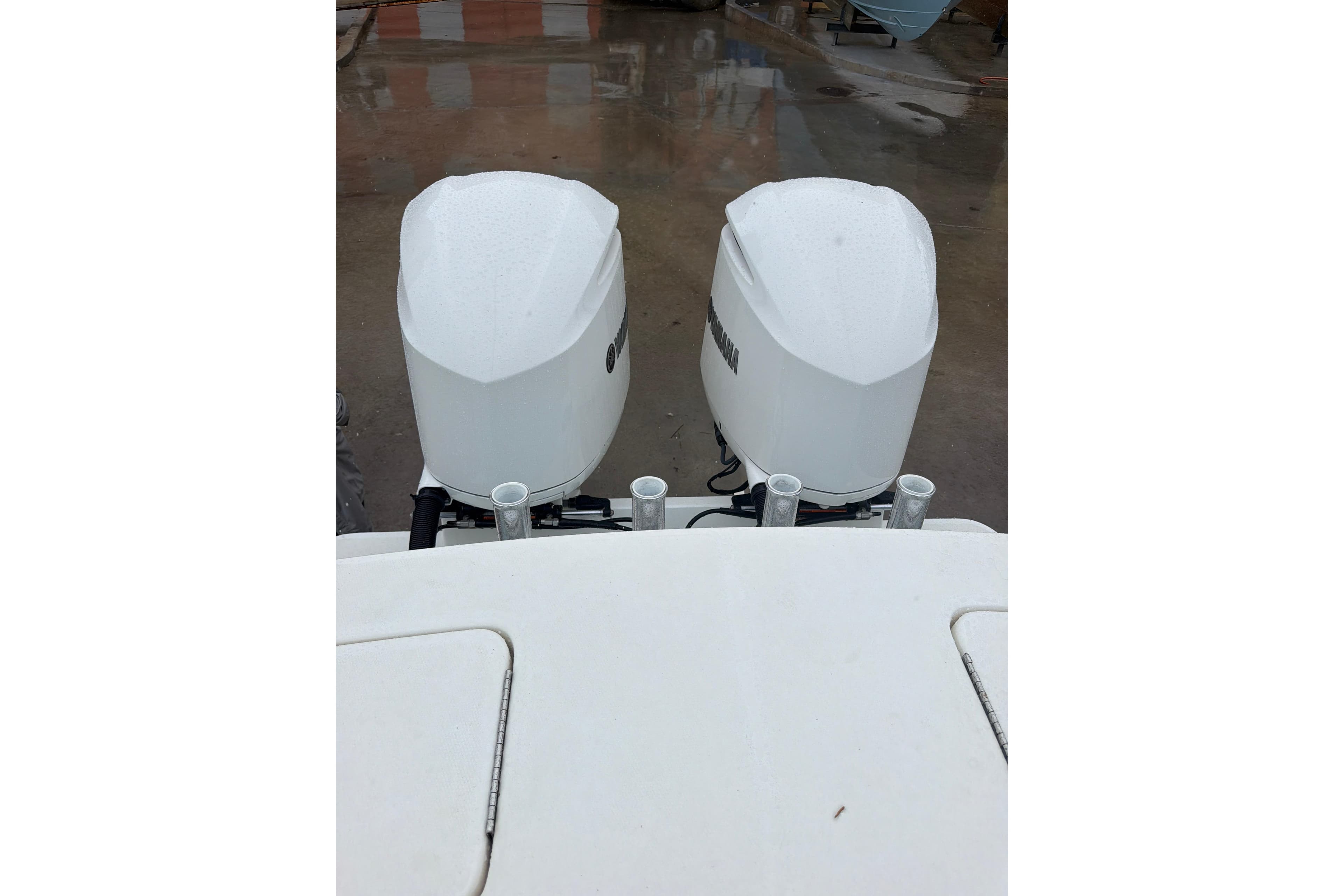 Twin outboard engines on a 2018 Regulator 31 boat, viewed from above.