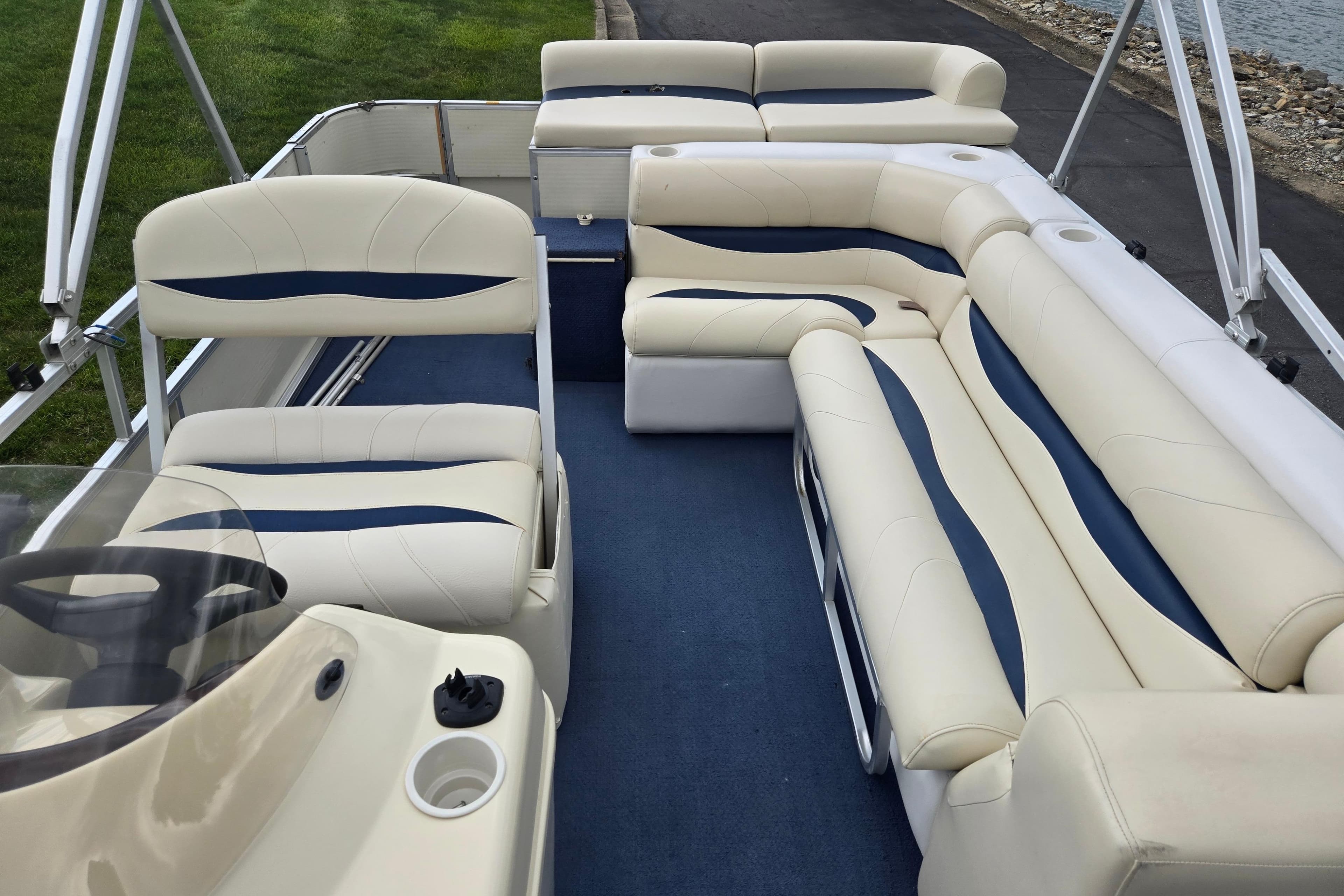 2004 Odyssey Pontoons 2302 Millennium interior with spacious seating and elegant design.
