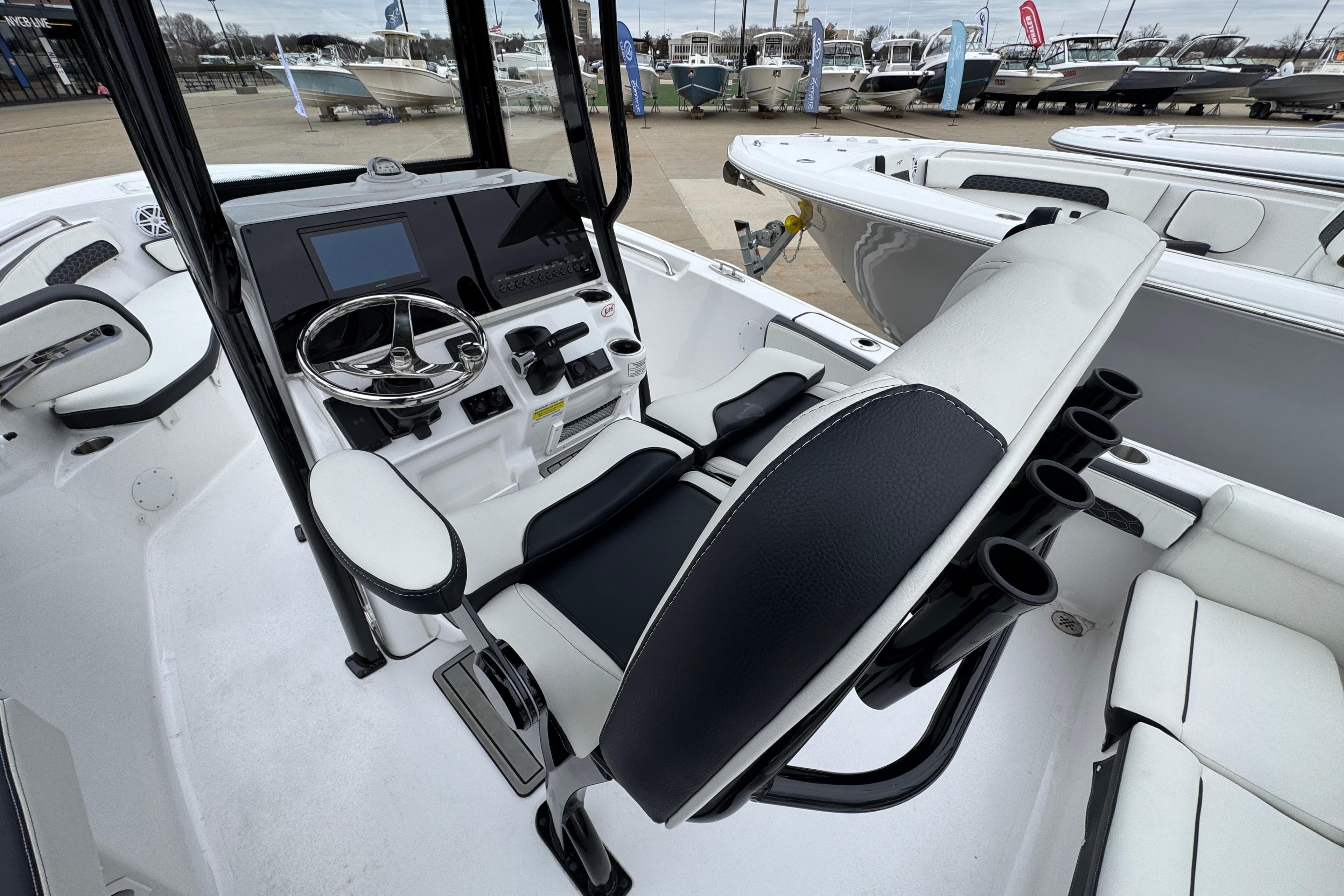 2026 Tidewater 220 LXF boat interior with steering console and seating.