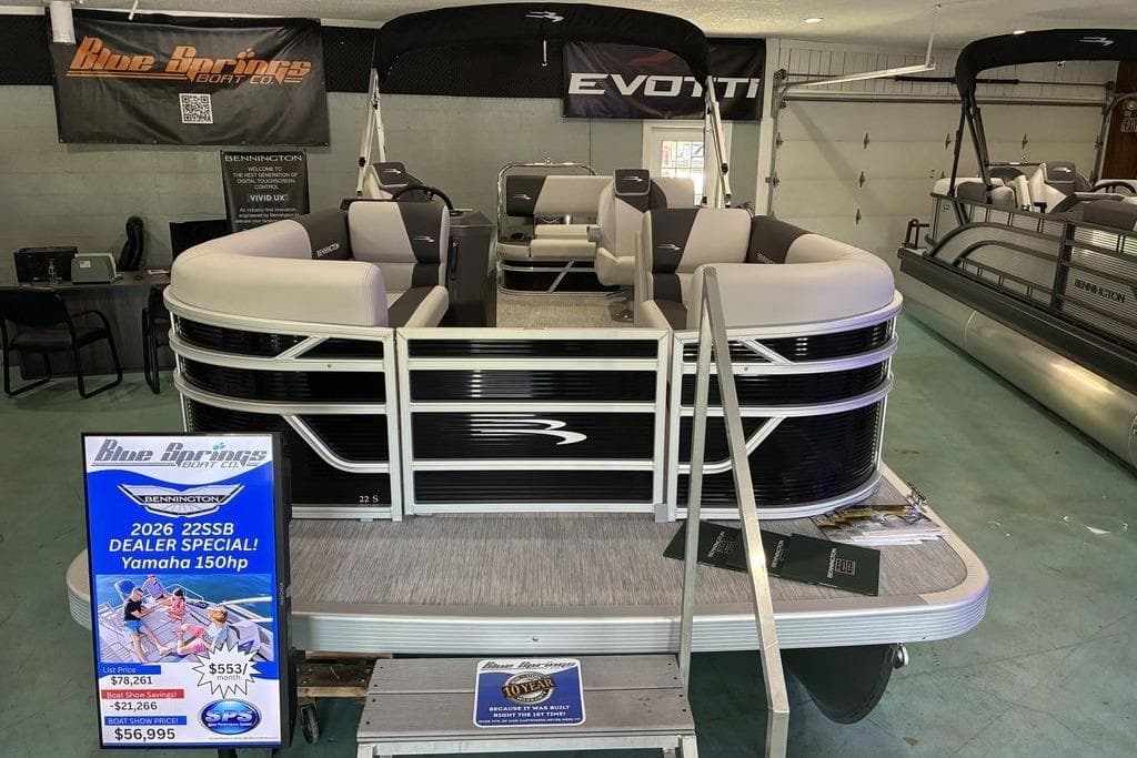 2026 Bennington S Quad Bench 22 SSR pontoon boat on display at dealership.