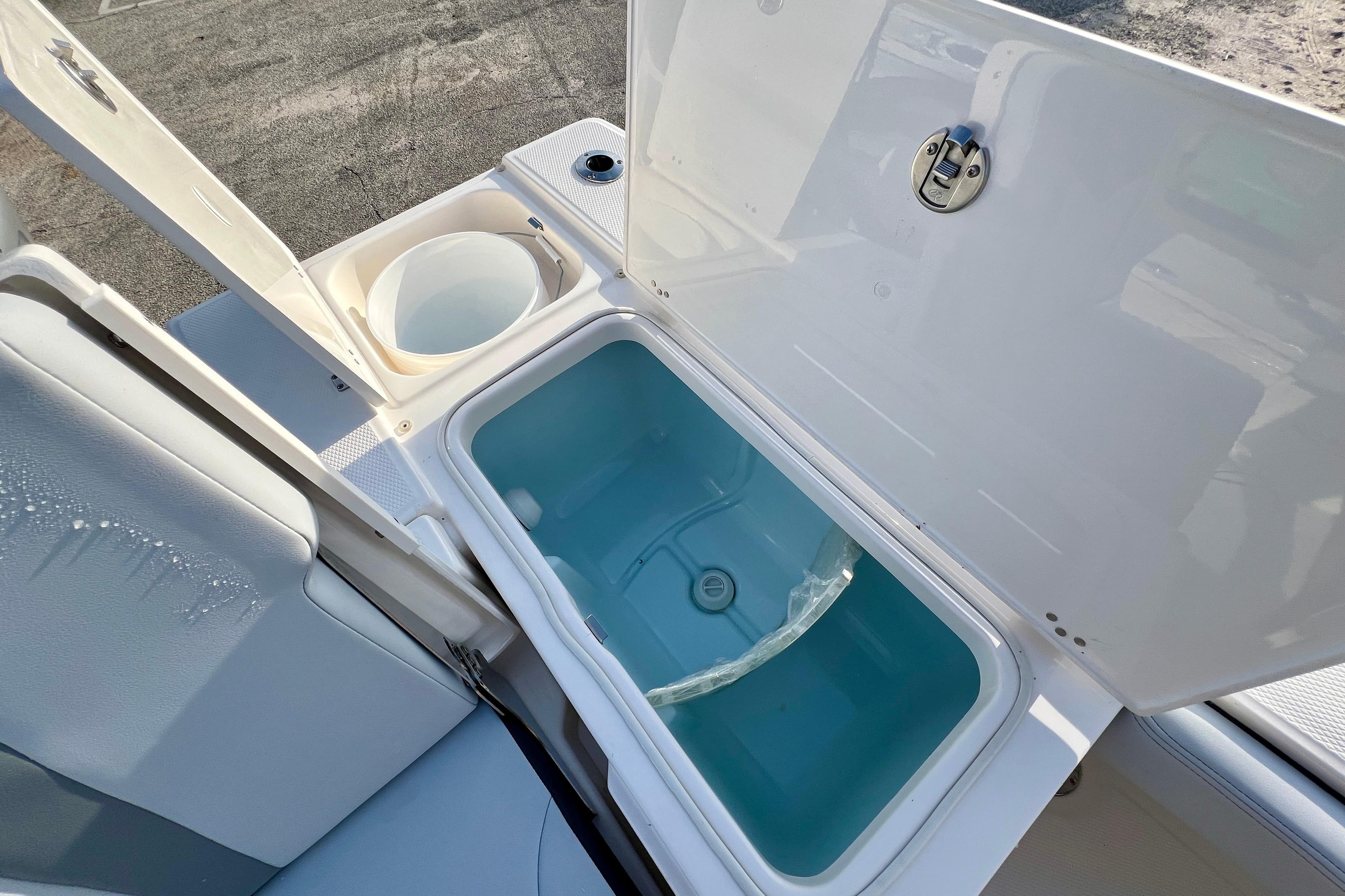 Livewell and storage compartments on 2026 Robalo 246 Cayman boat.