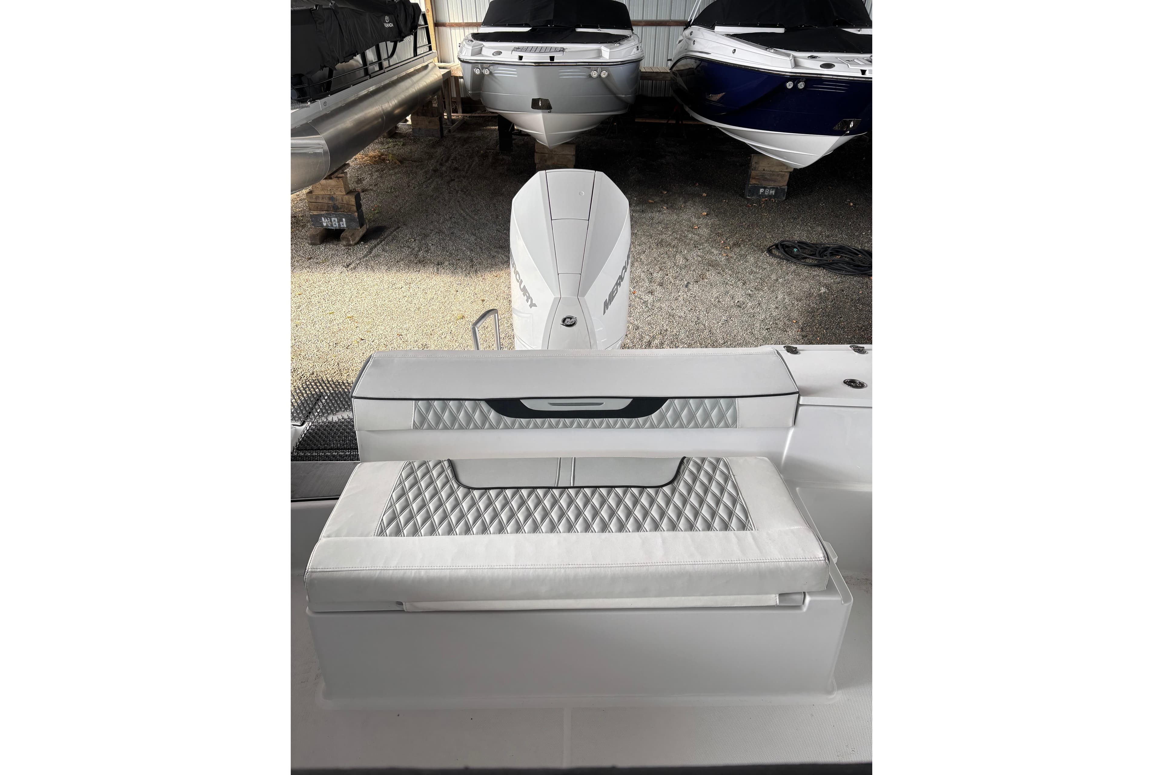 2024 Blackfin 222 CC boat interior with cushioned seating and sleek design.