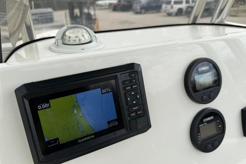 2024 Key West 203 FS boat dashboard with Garmin navigation and Yamaha gauges.