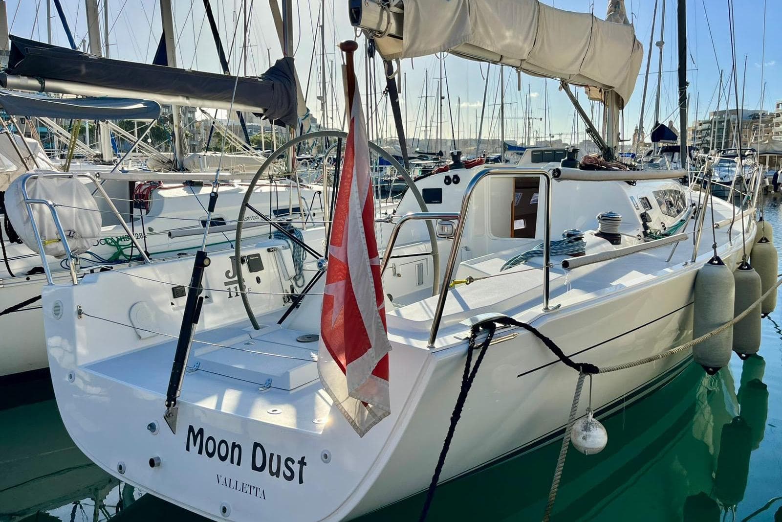 2018 J-Composites J/112E sailboat "Moon Dust" docked in a marina.