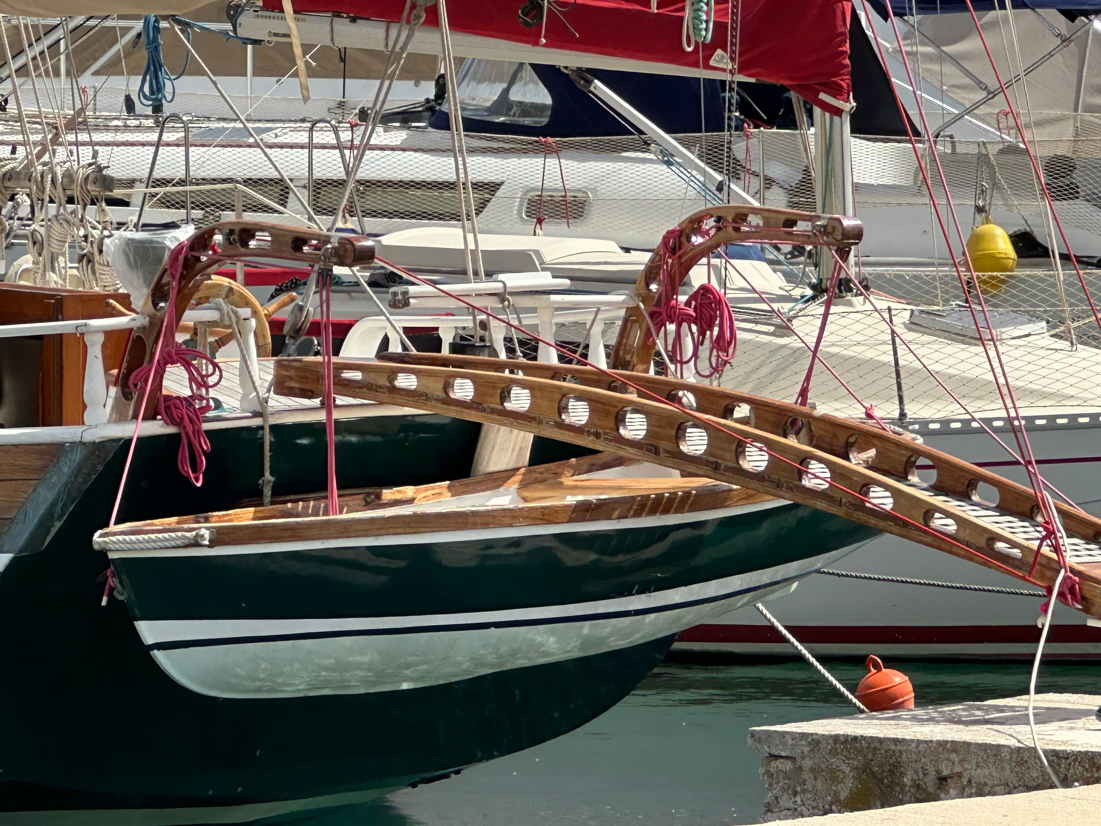 Vintage 1966 Canadian gaff rigged whaler schooner docked at a marina.