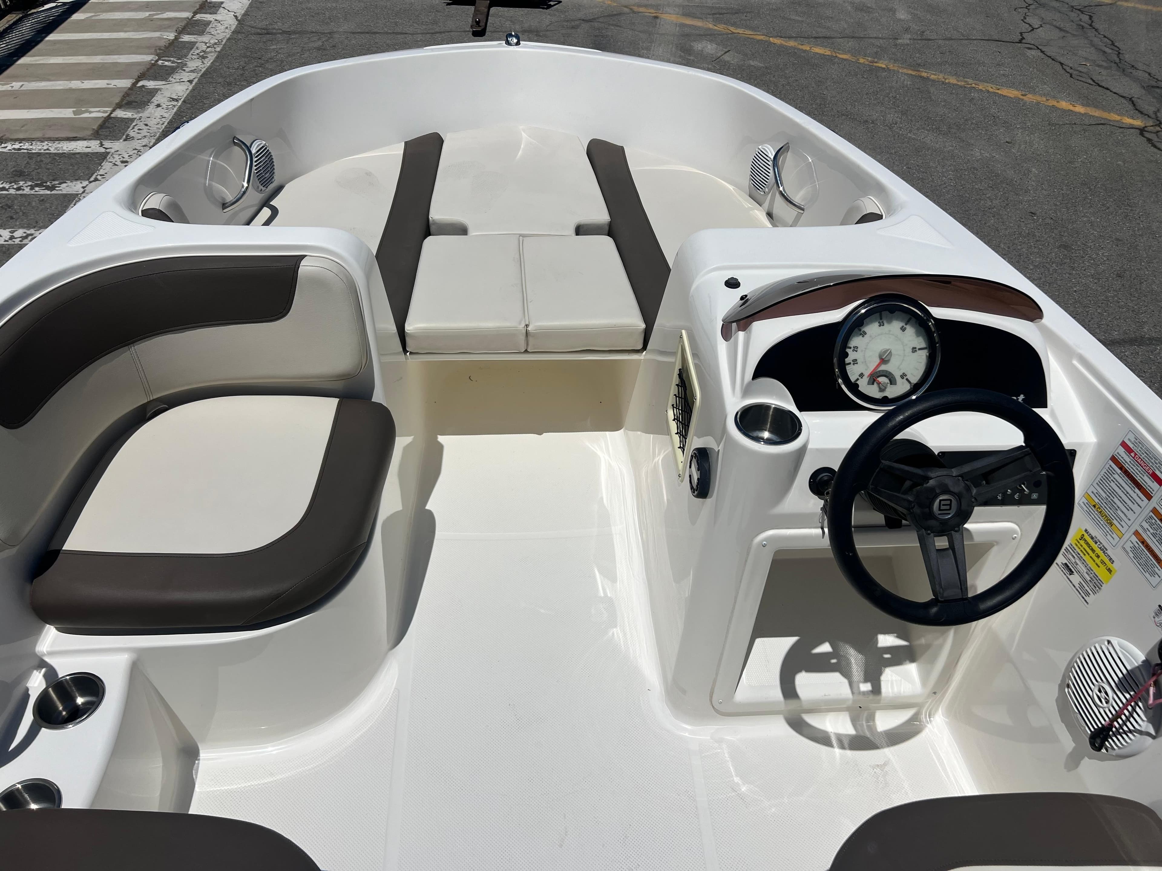 2023 Bayliner Element E18 boat interior with seating and steering console.