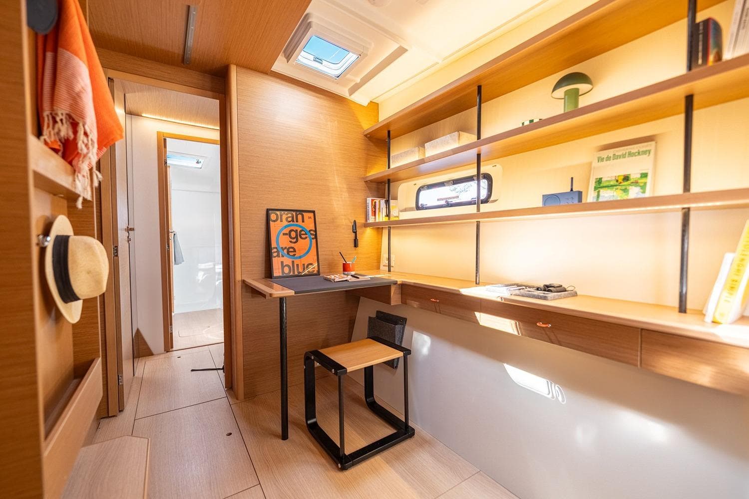 Manufacturer Provided Image: Modern interior of Excess 13 yacht, 2026 model, featuring a stylish workspace and shelving.