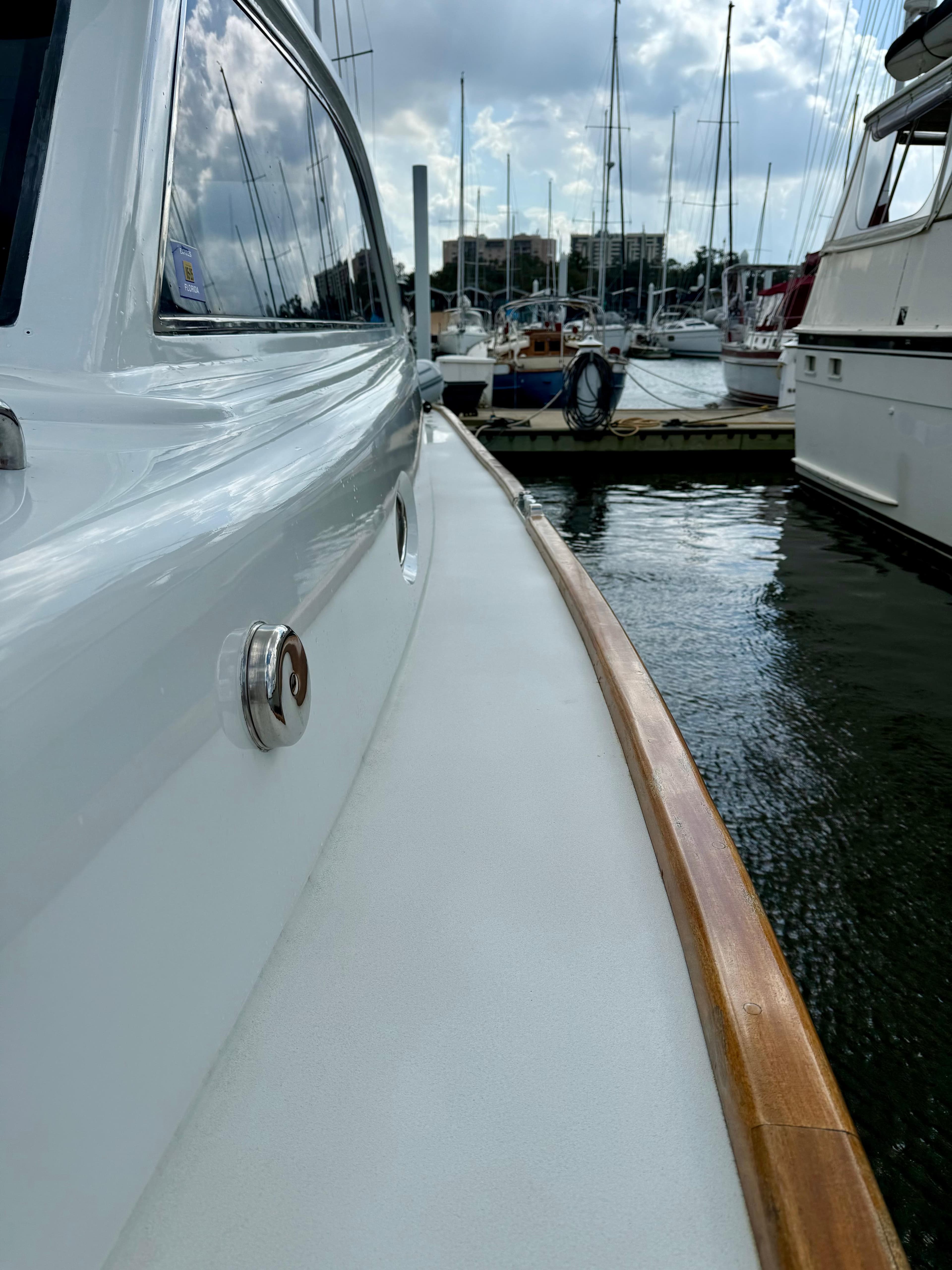 Side view of Limited Edition Soluna 46 yacht in harbor.
