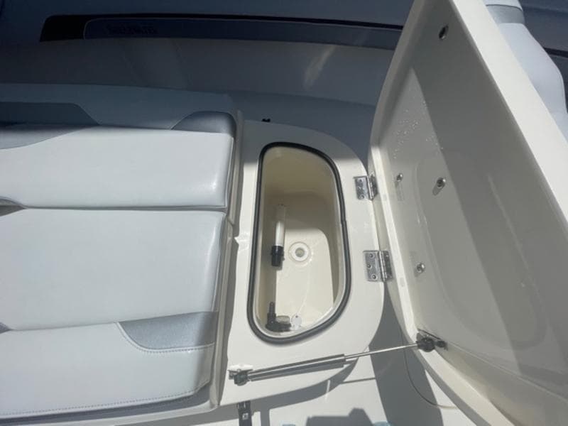 2020 ShearWater 270 Carolina Flare boat storage compartment with open lid.