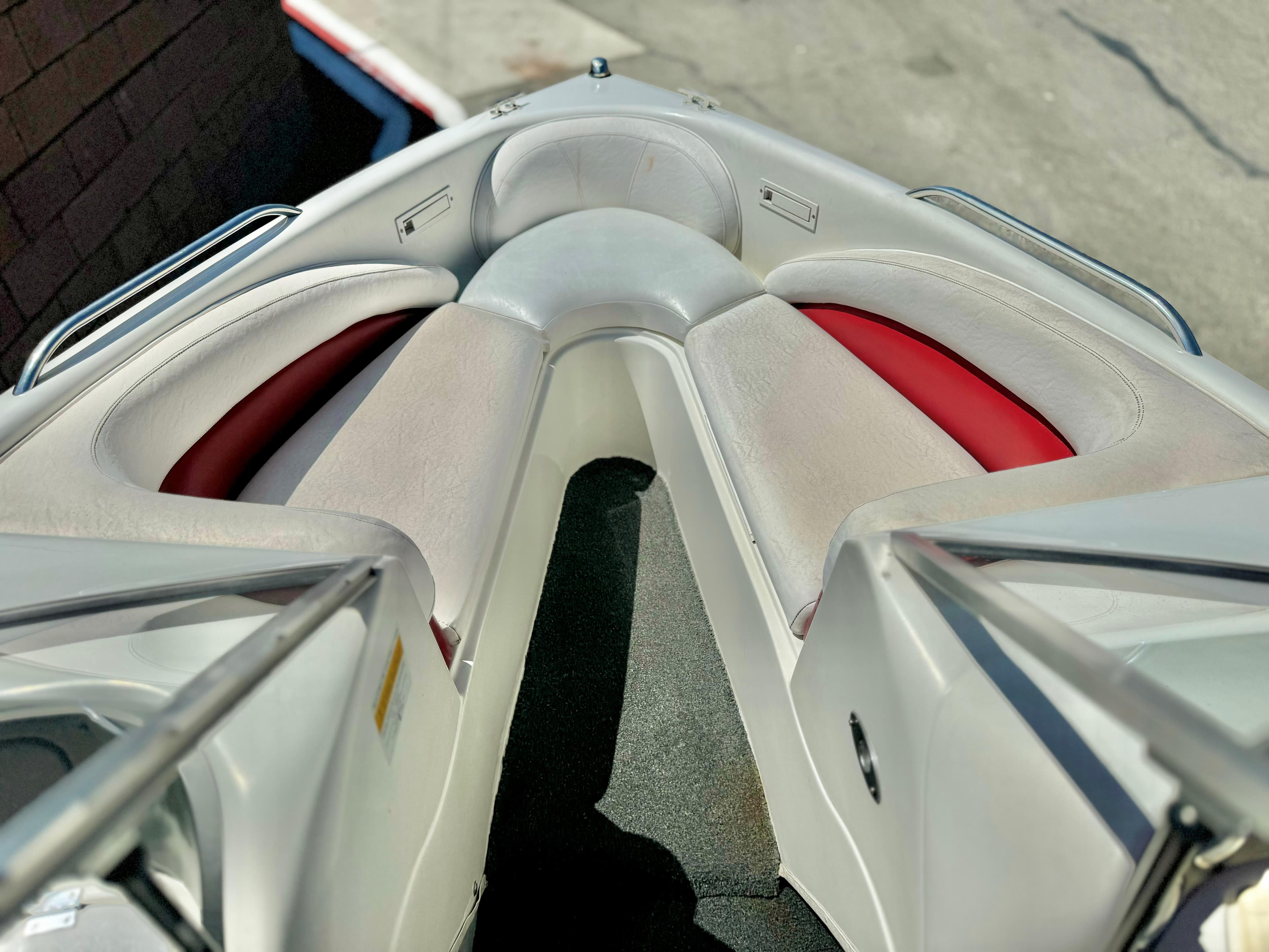 1998 VIP Vixen boat interior with red and gray seating.