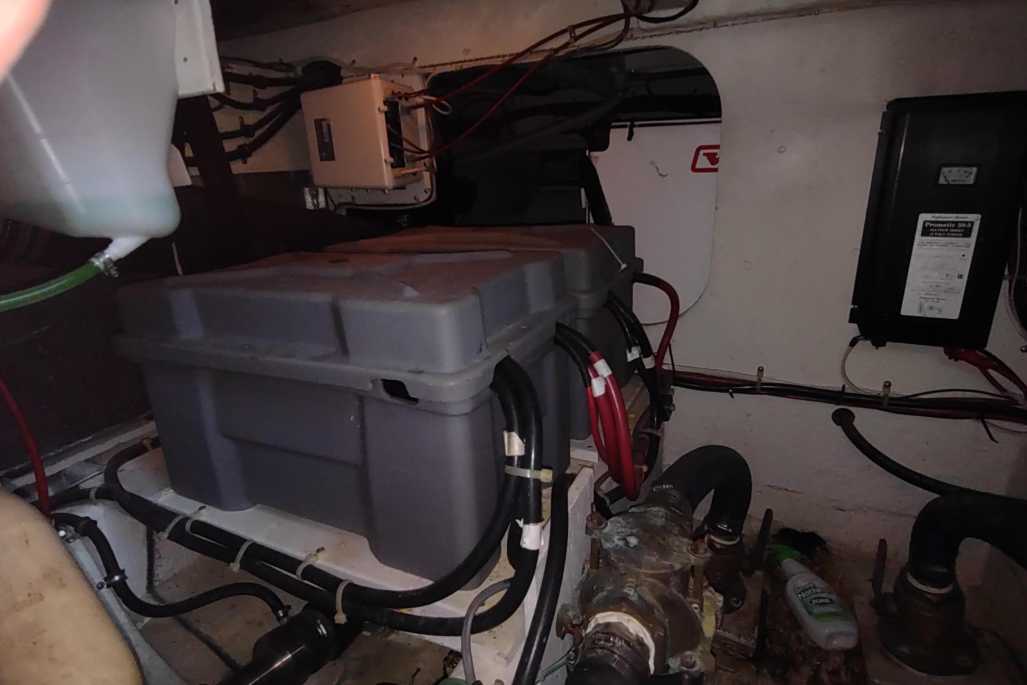 Engine room of 2001 Maxum 4600 SCB yacht with visible equipment and wiring.