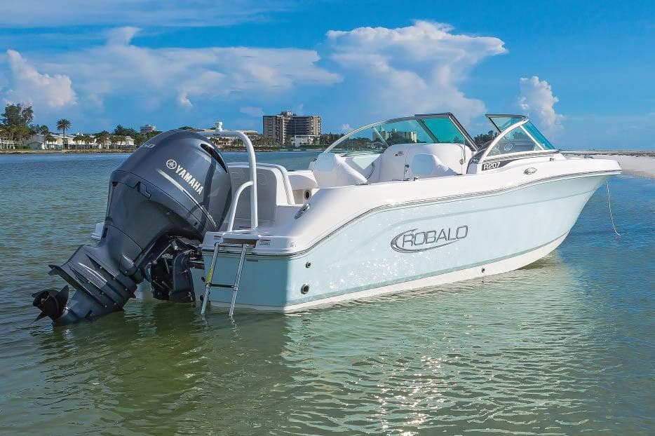 Manufacturer Provided Image: 2025 Robalo R207 Dual Console boat with Yamaha engine on calm water.