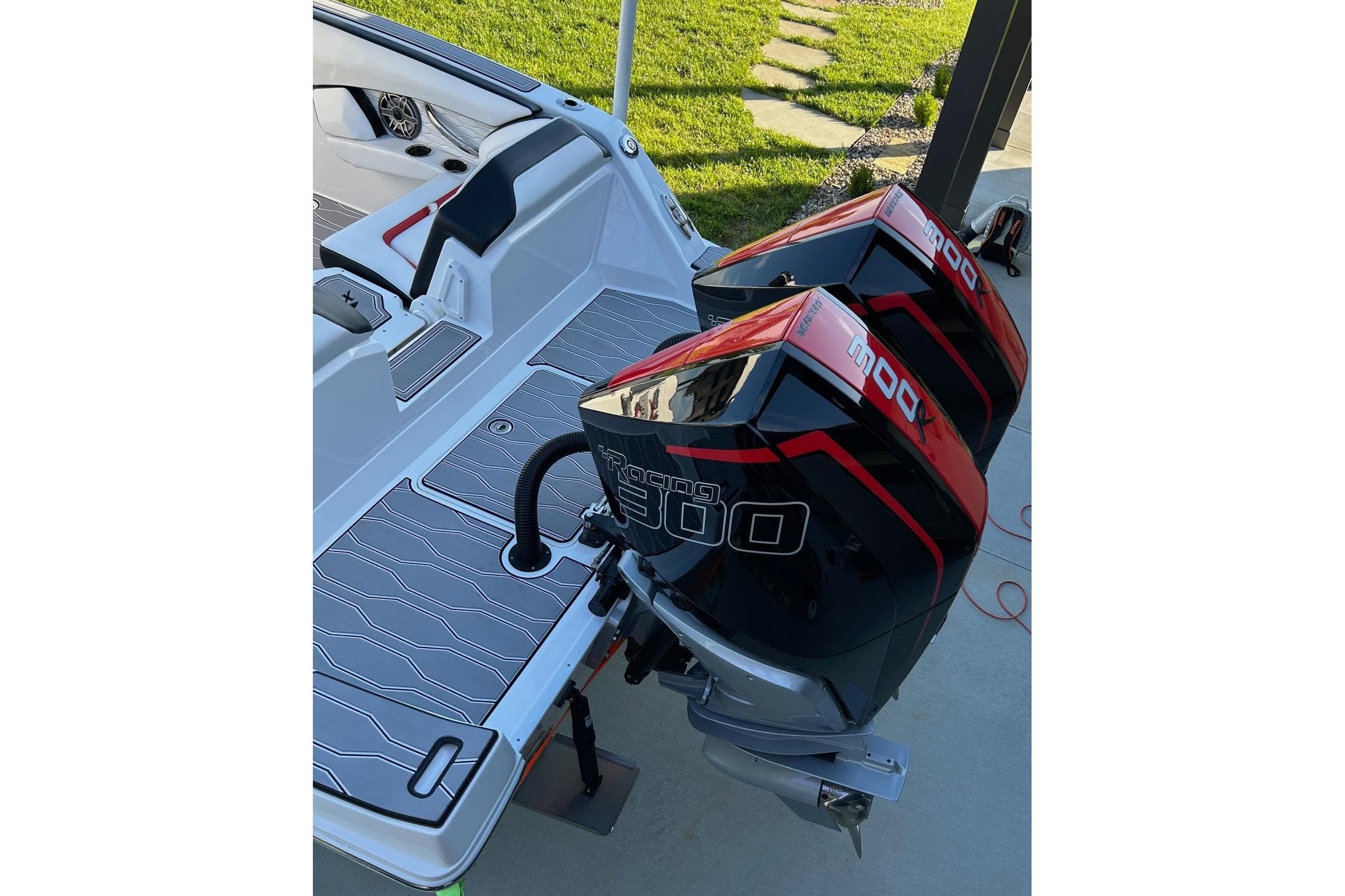 2023 Sunsation 32 CCX boat with twin Mercury Racing 300 outboard engines.