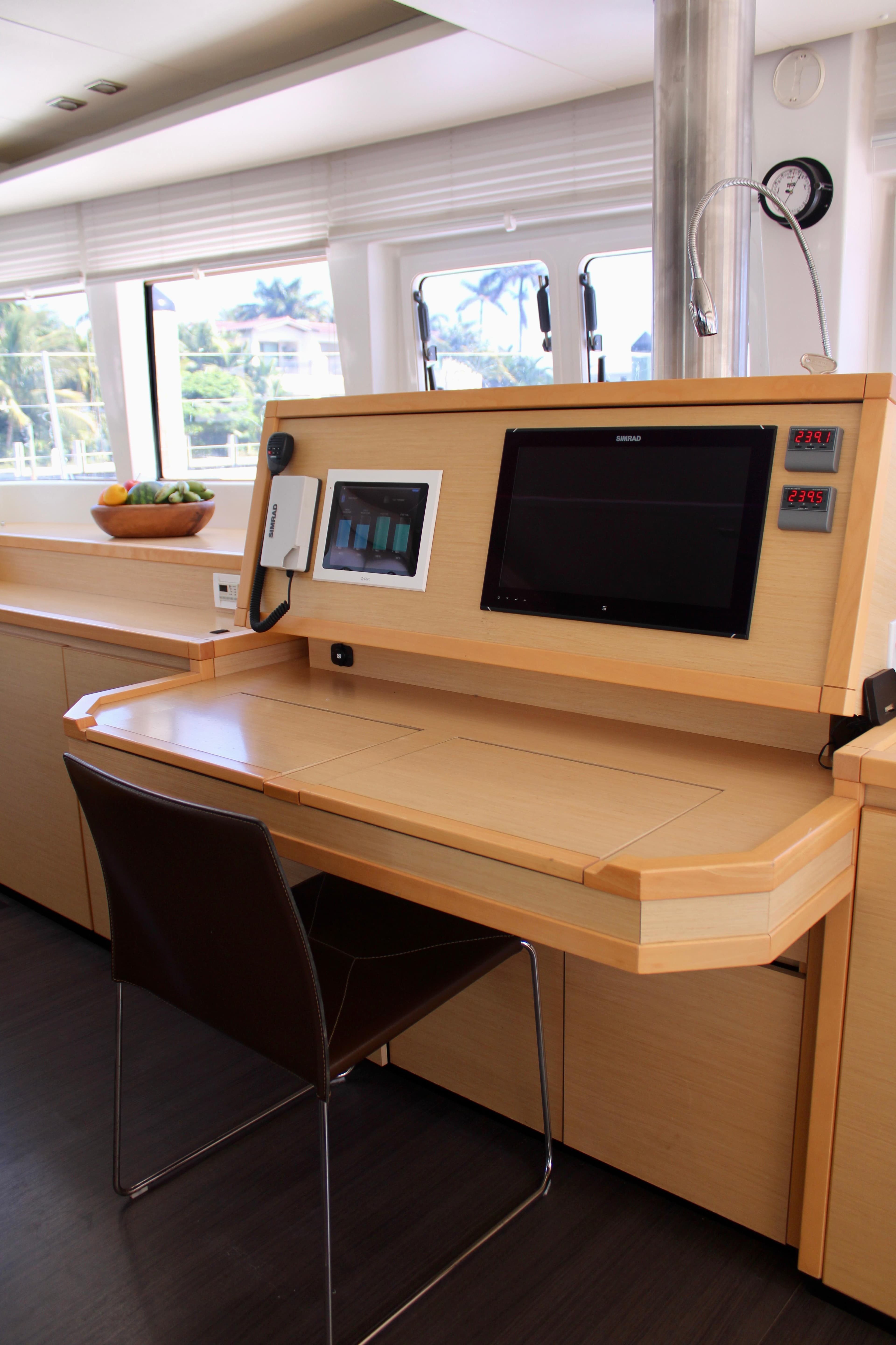 Navigation station on a 2015 Lagoon 620 catamaran with modern equipment.