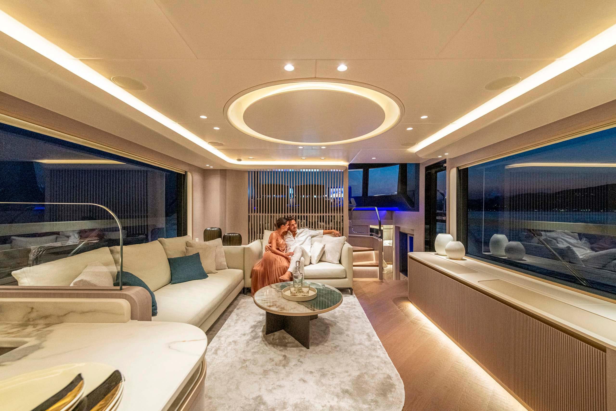 Luxurious interior of 2026 Absolute 70' Navetta yacht with elegant seating and ambient lighting.
