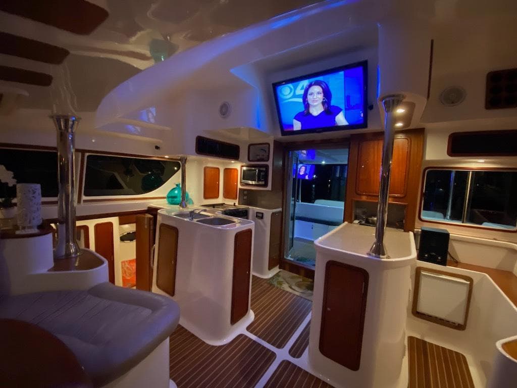 Luxurious interior of 2013 Africat Marine AfriCat PowerCat Sportfisher with modern amenities and TV.