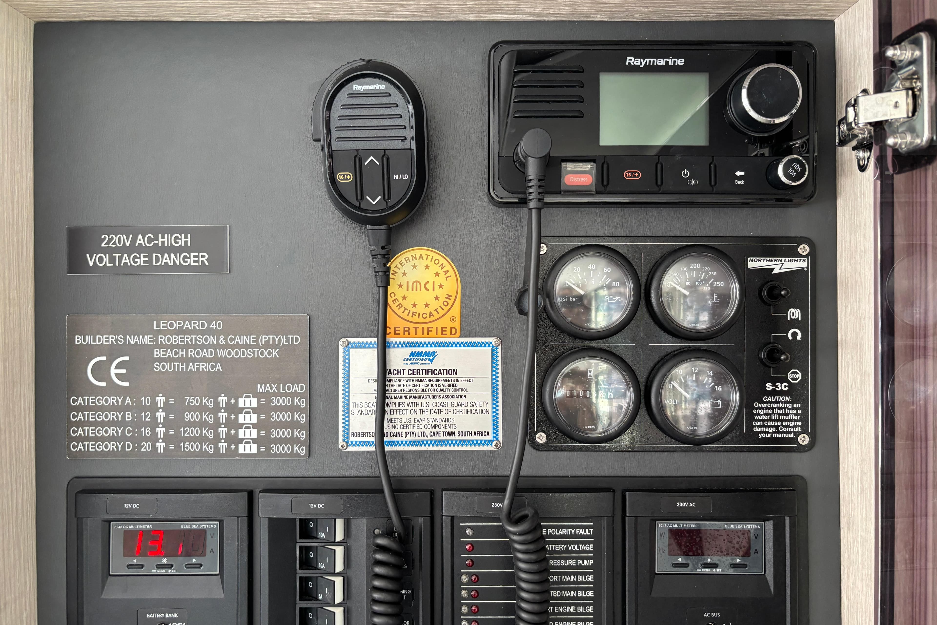 Electrical control panel of a 2019 Leopard 40 yacht with safety warnings and gauges.