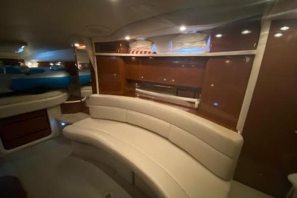Interior of 2008 Sea Ray 340 Sundancer yacht with elegant seating and wood finishes.