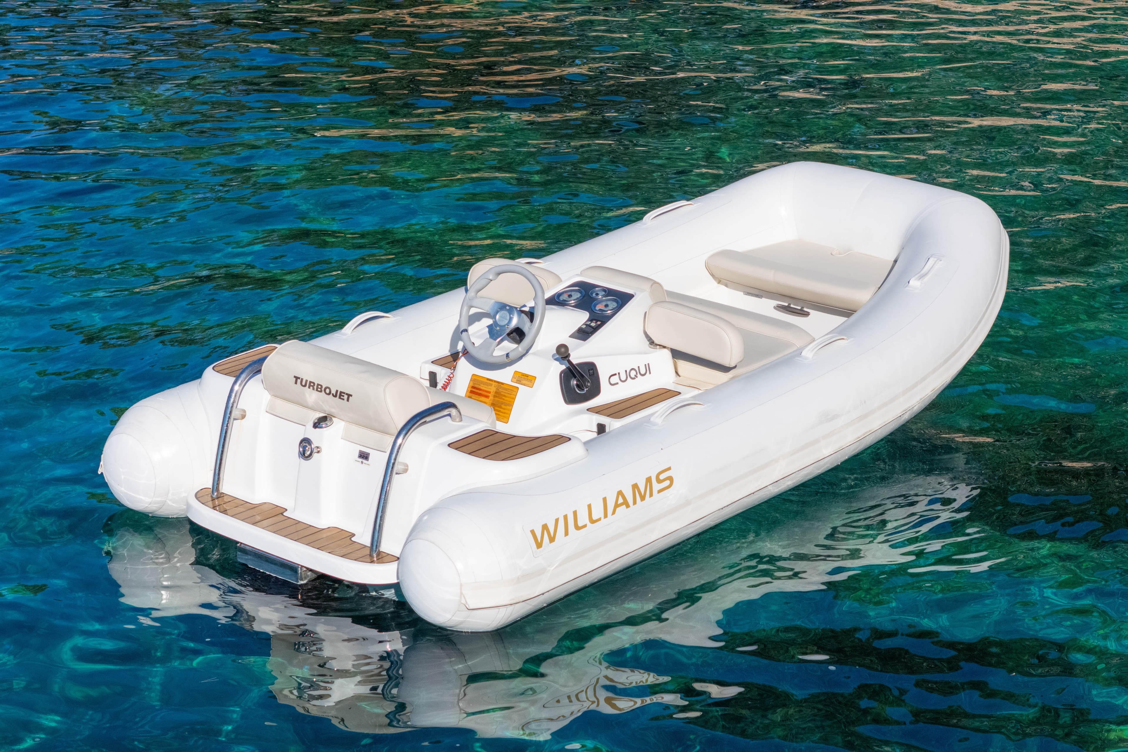 2014 Williams Jet Tenders Turbojet 325 on clear blue water.
