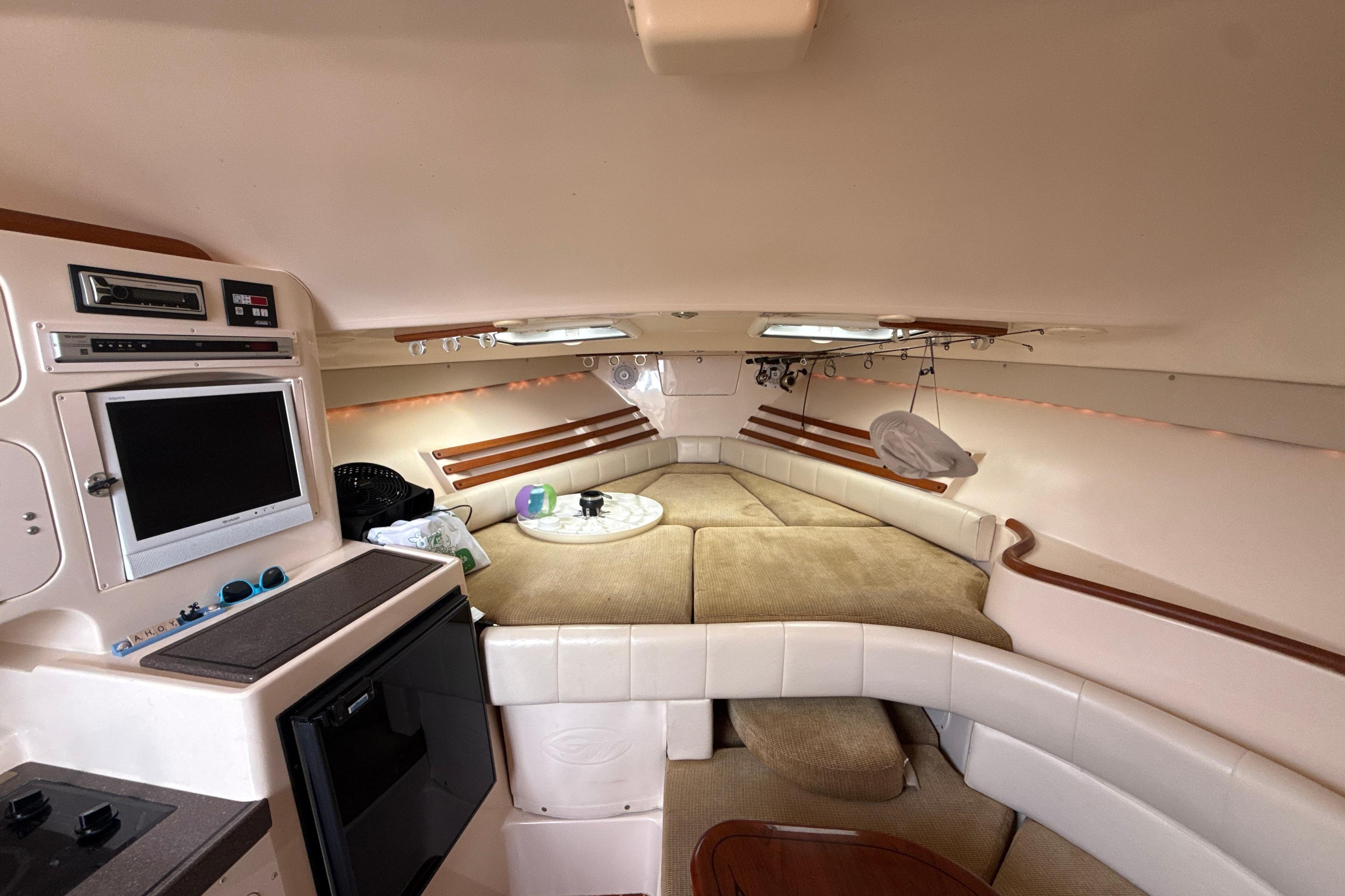 Interior of 2005 Grady-White Express 330 boat with cozy seating and entertainment area.