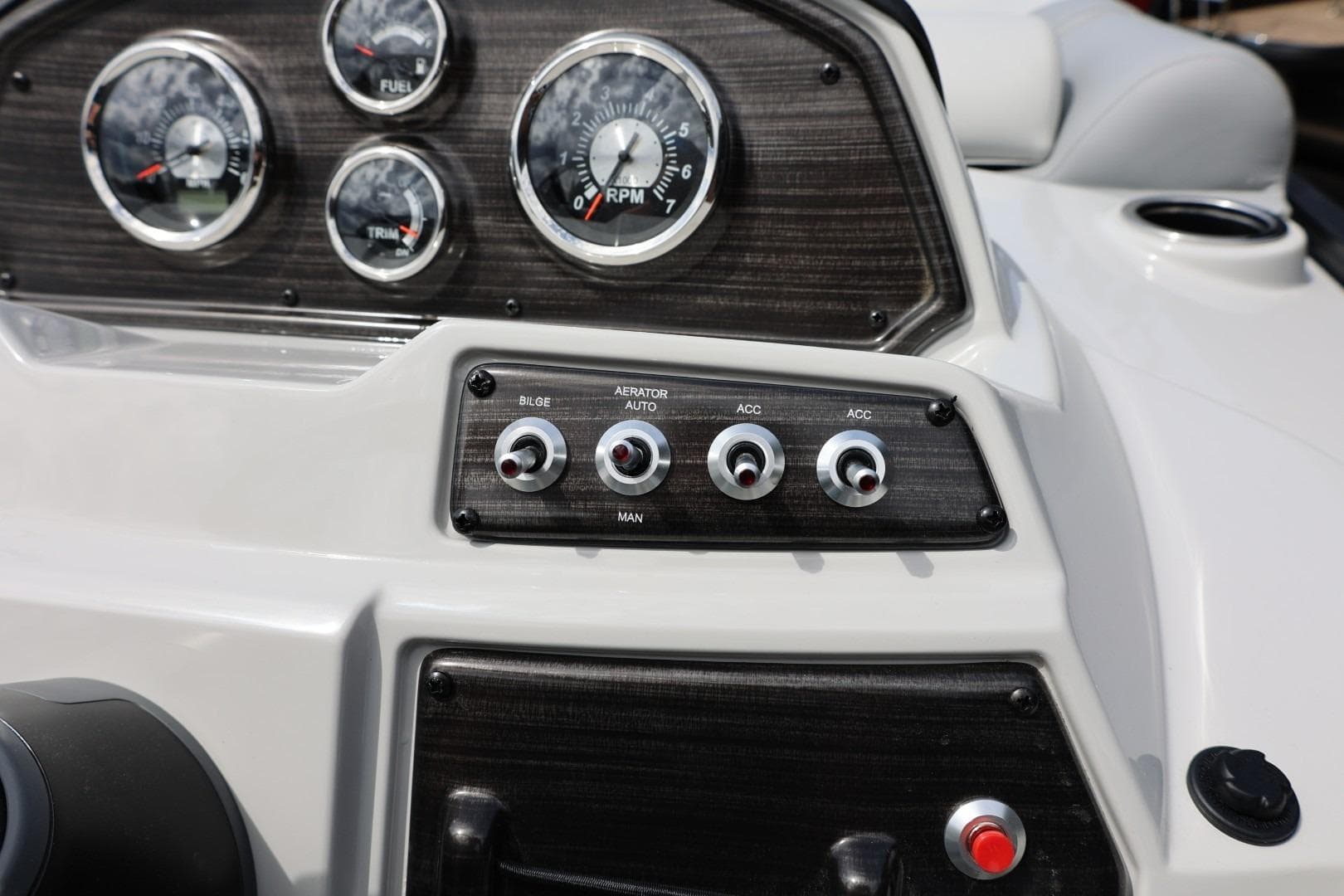 Dashboard of 2026 Lowe SS 210 CL boat with gauges and switches.