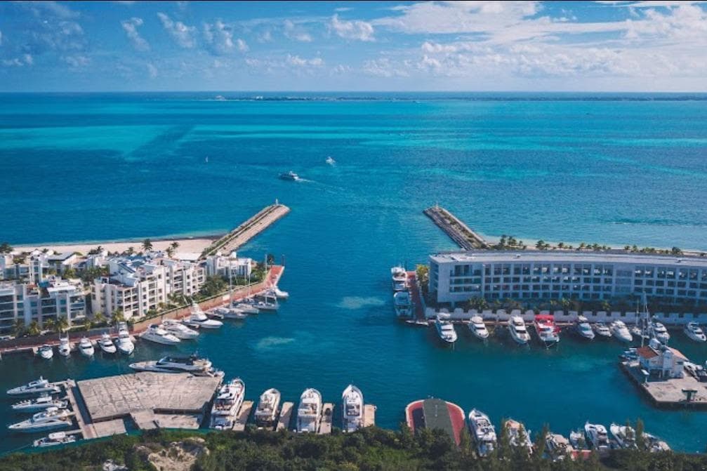 Aerial view of marina with yachts, featuring Azimut Atlantis 40, 2011 model.