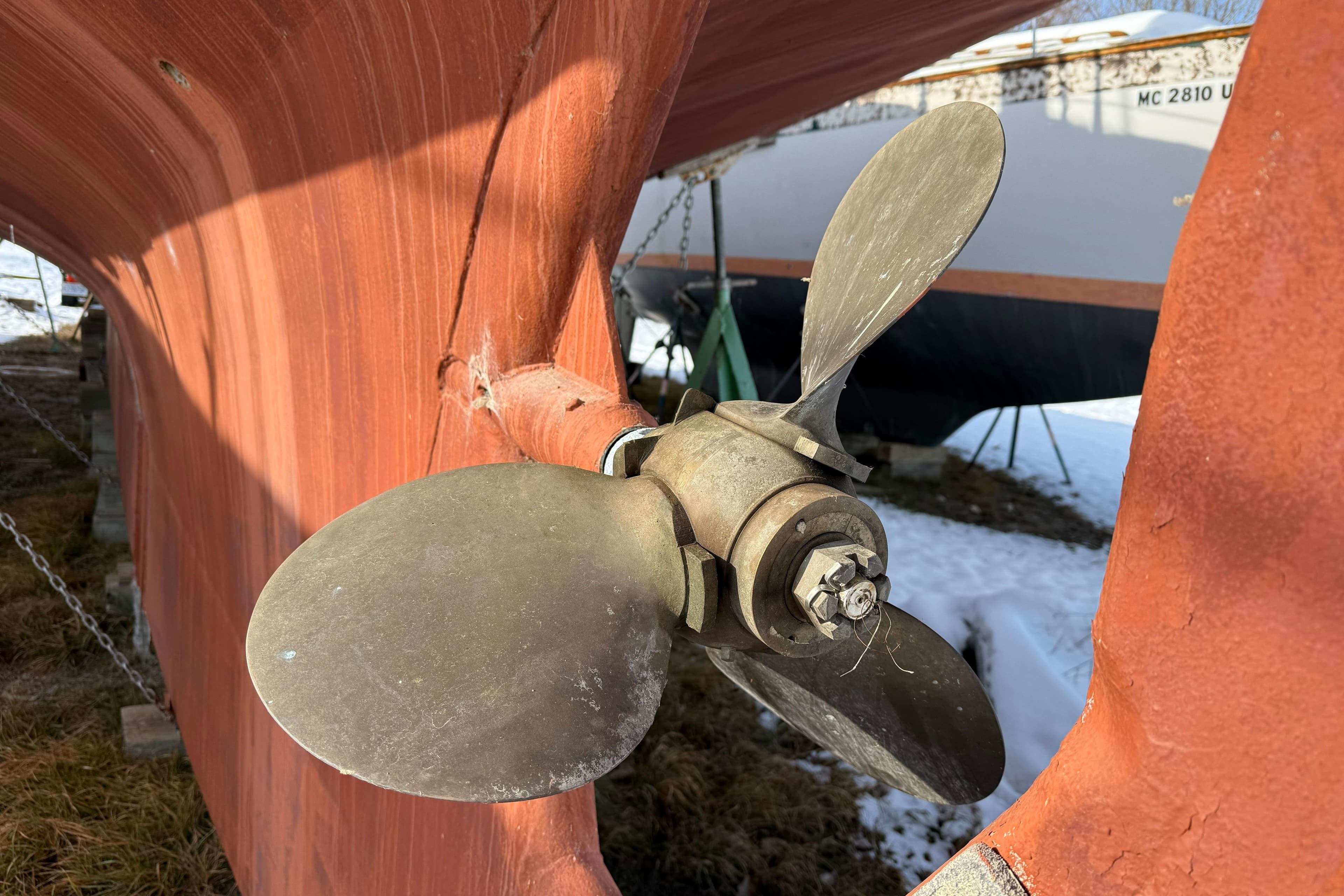 Propeller of 1992 Treworgy 65 Schooner, close-up view, dry docked.