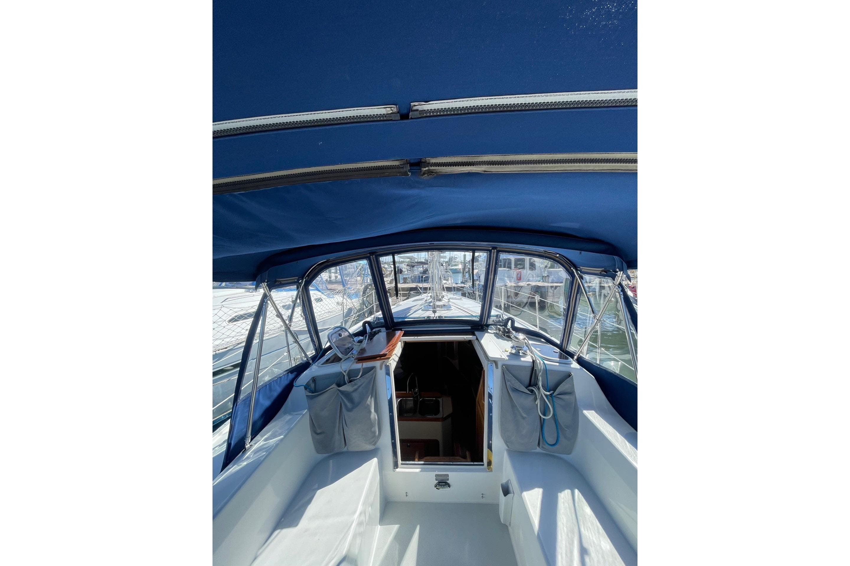 Interior view of a 1999 Catalina 36 MkII sailboat cockpit with blue canopy.