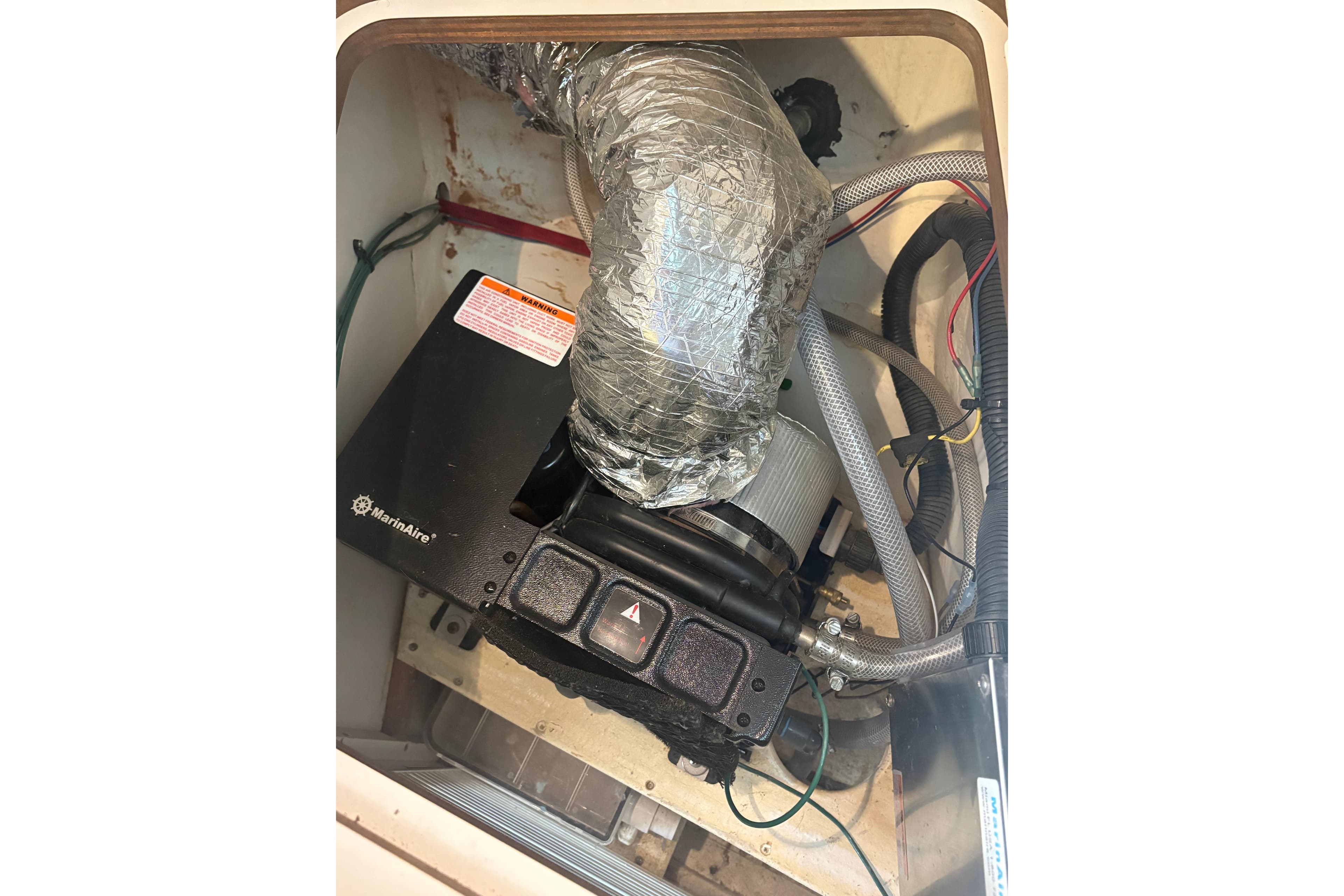 1999 Tiara Yachts 2900 Coronet engine compartment with wiring and ductwork.