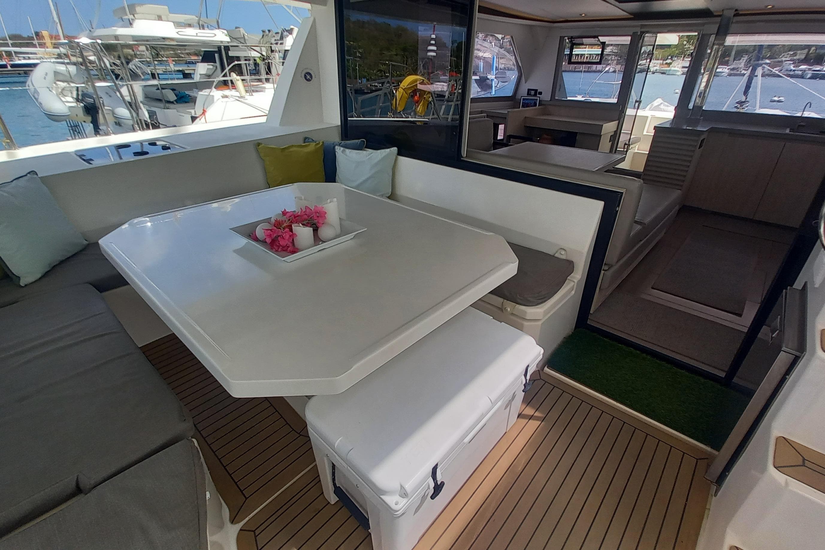 Luxurious 2019 Leopard 45 yacht interior with elegant seating and dining area.