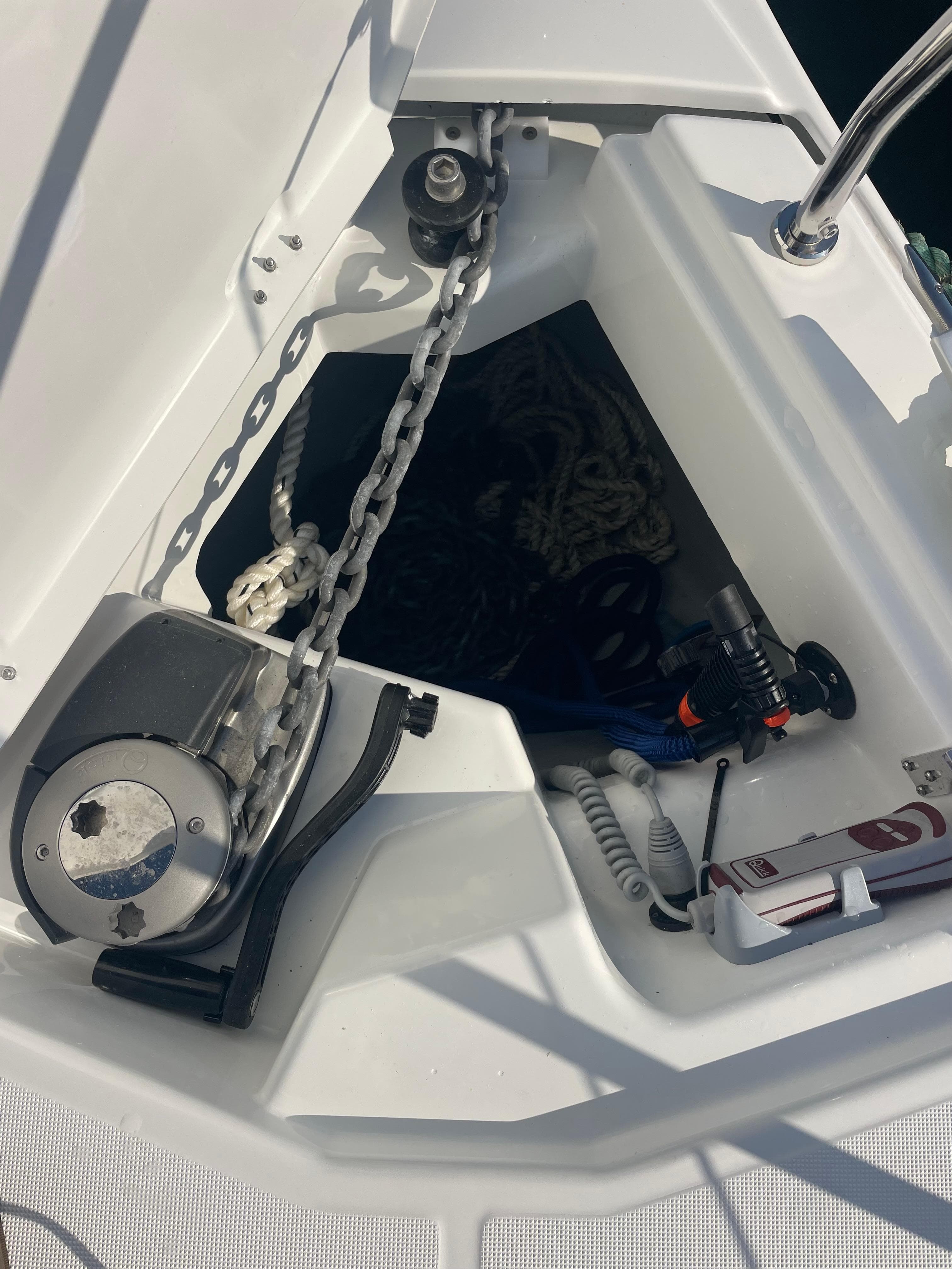 Anchor windlass with handheld remote and anchor washdown system.