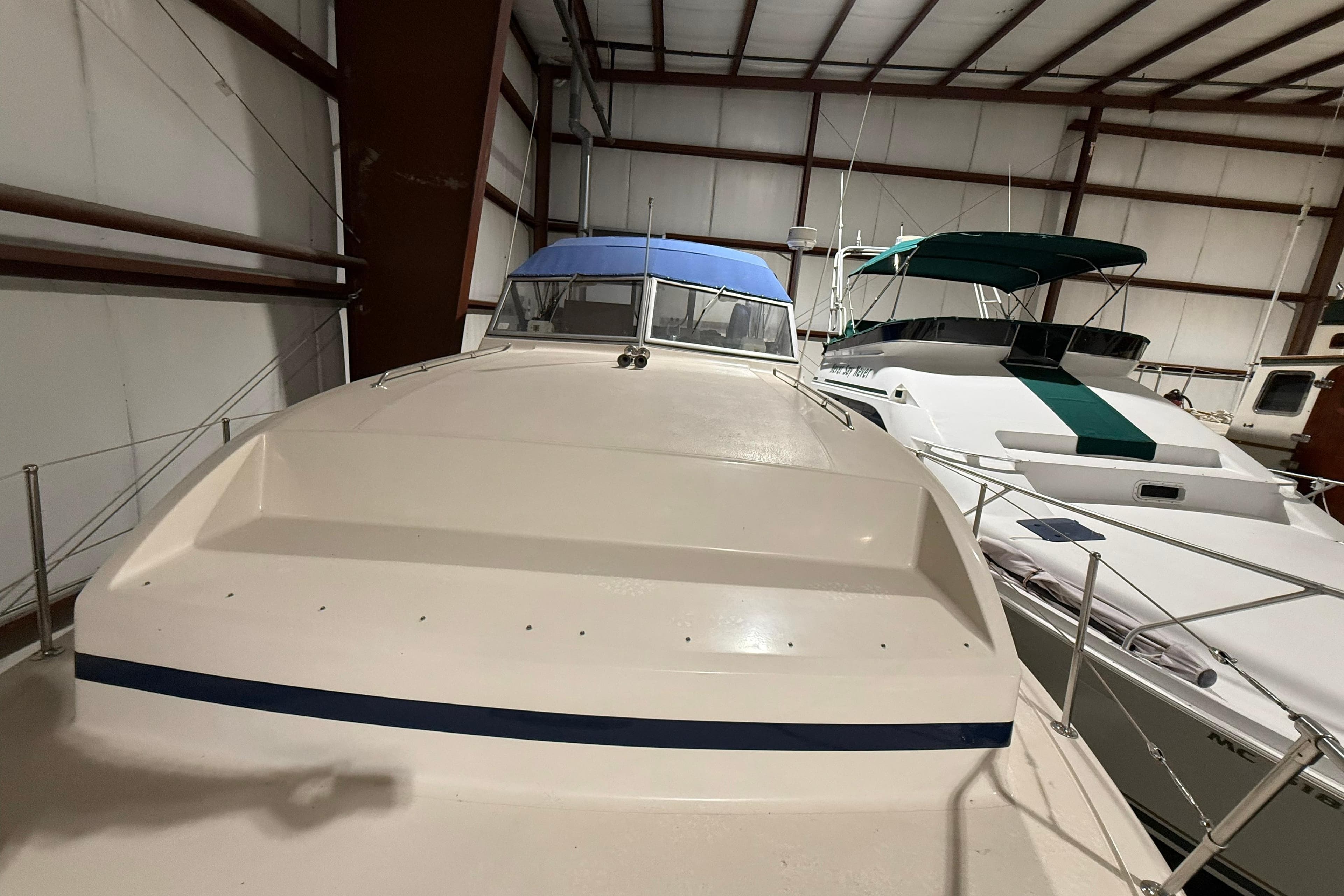 1979 Chris-Craft 350 Catalina yacht in indoor storage, showcasing classic design.