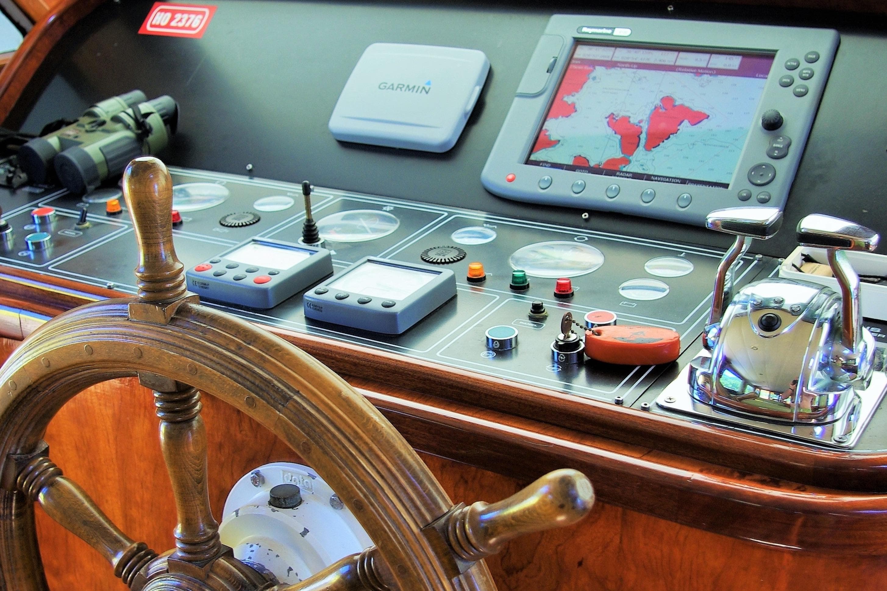 Wooden ship helm with navigation equipment, Baymarin Custom 1992 model.