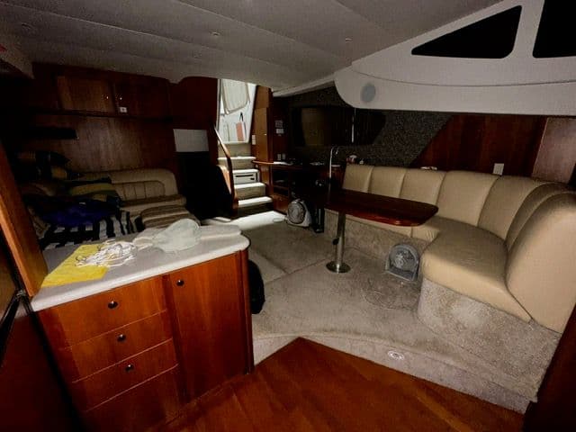 Interior of 2002 Silverton 39 Motor Yacht with cozy seating area.