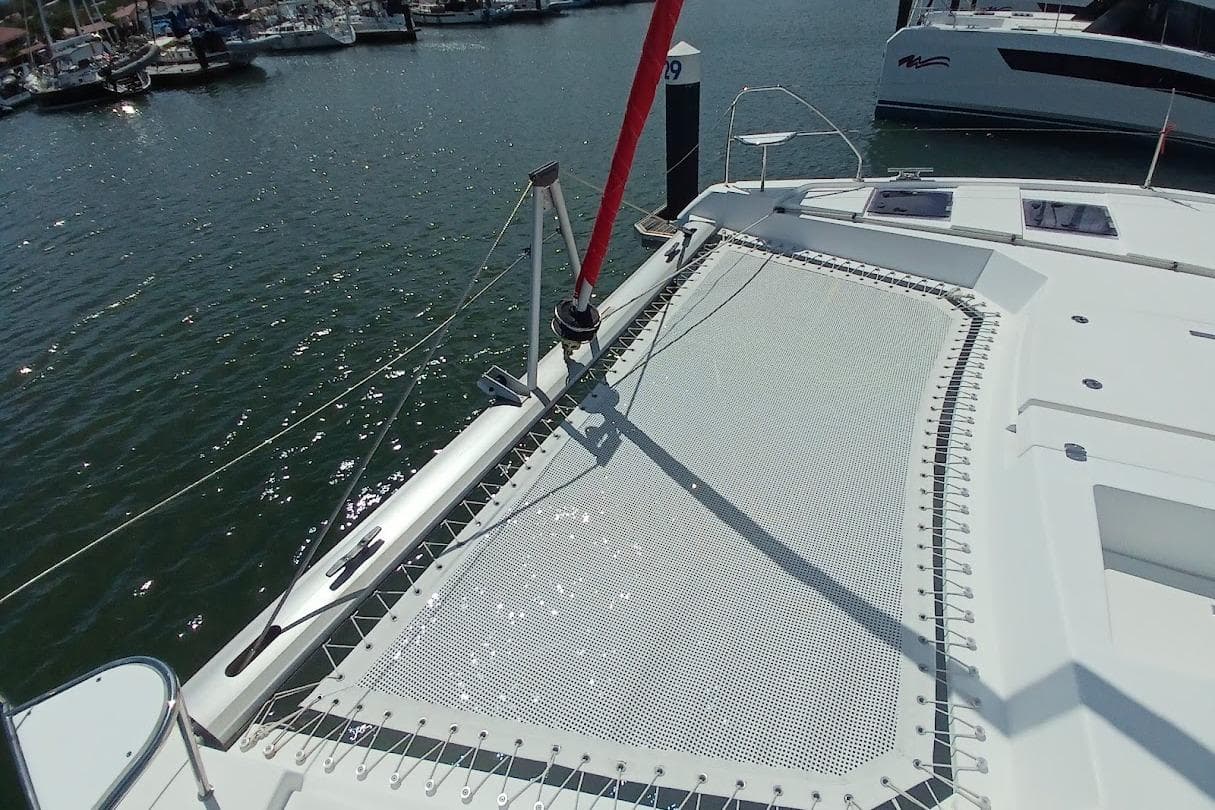 2022 Leopard 42 catamaran with netting on deck, docked in marina.