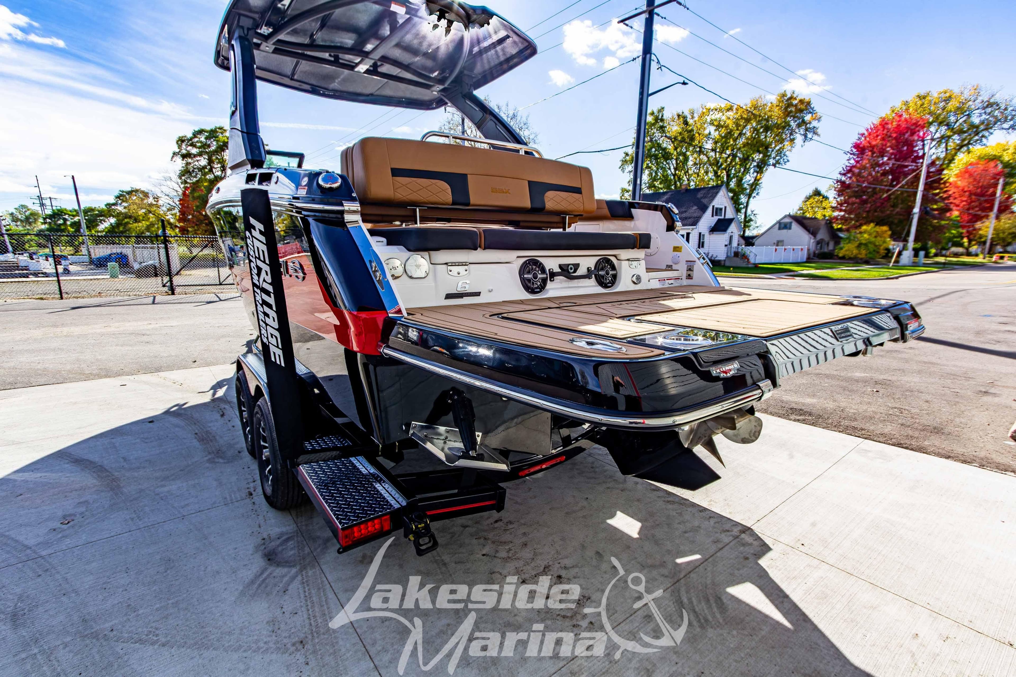2026 Chaparral SSX 6 boat on trailer at Lakeside Marina, showcasing sleek design.