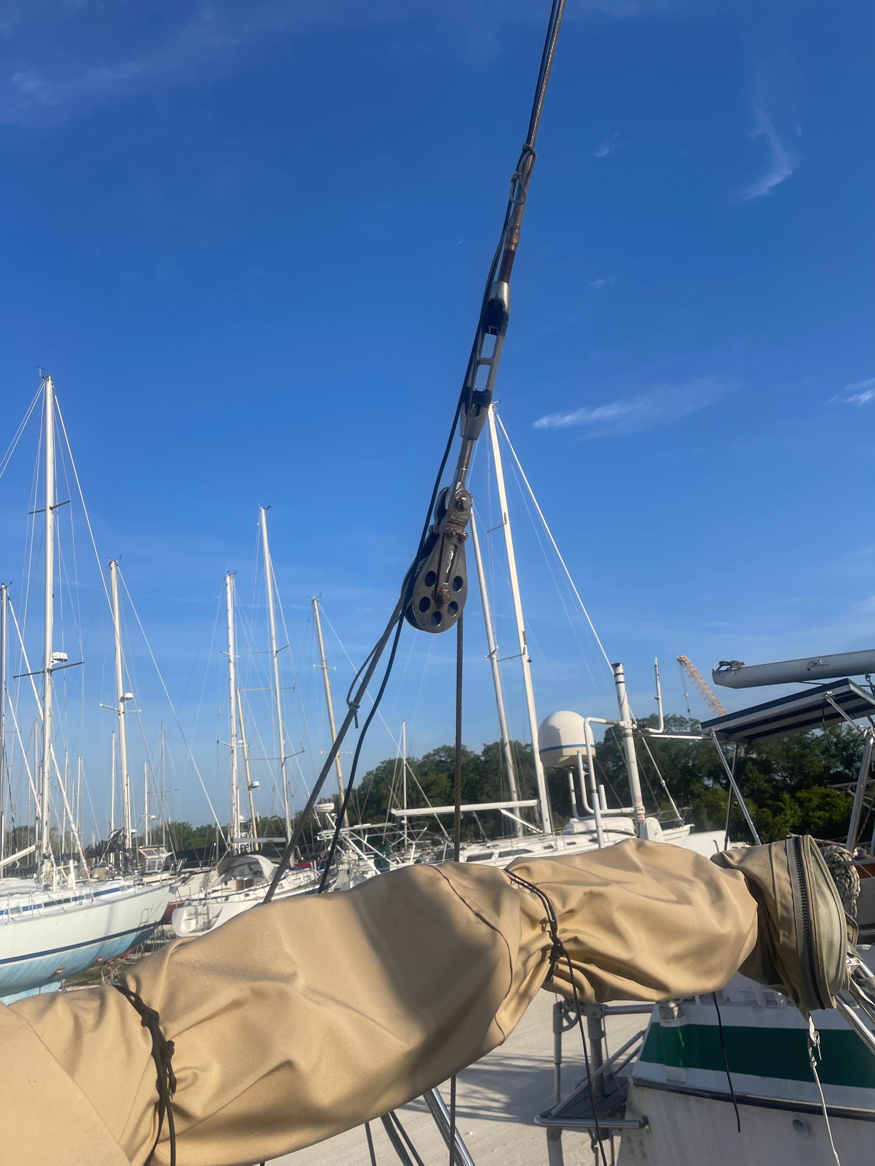 Sailboat rigging on a 1984 Hanseat 37 under a clear blue sky.
