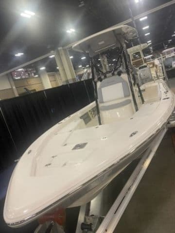 2025 Avenger Boats AV24 displayed indoors on a trailer.
