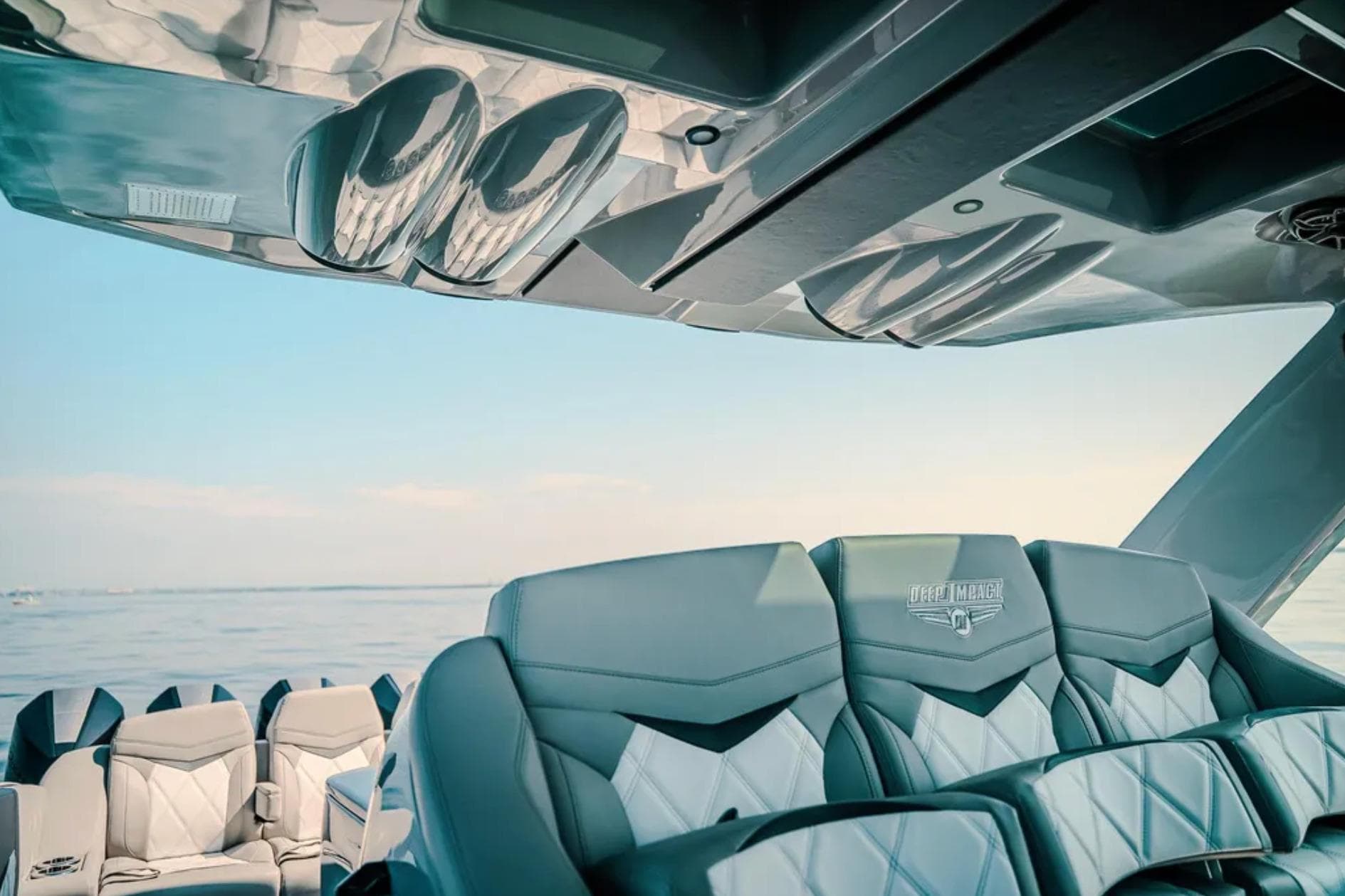 Luxurious interior of 2026 Deep Impact 499 Sport boat with ocean view.