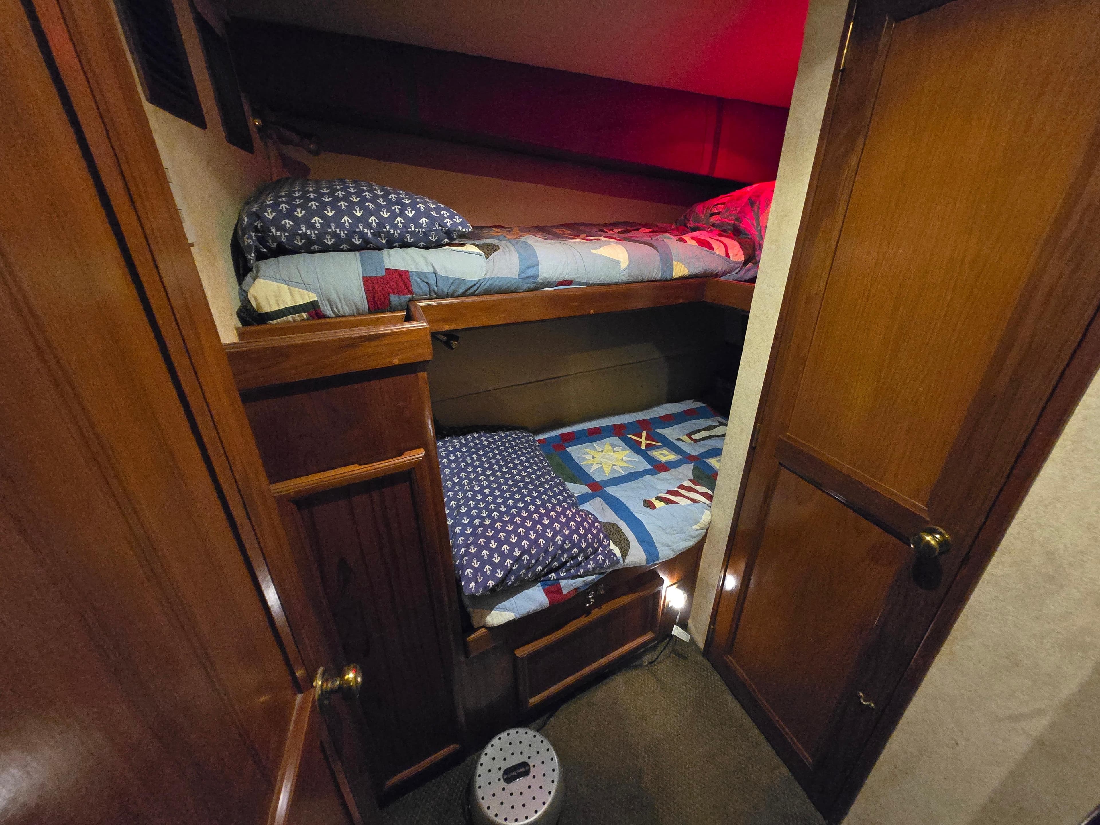 Bunk beds in 1995 Egg Harbor 42 Convertible yacht cabin with wooden interior.