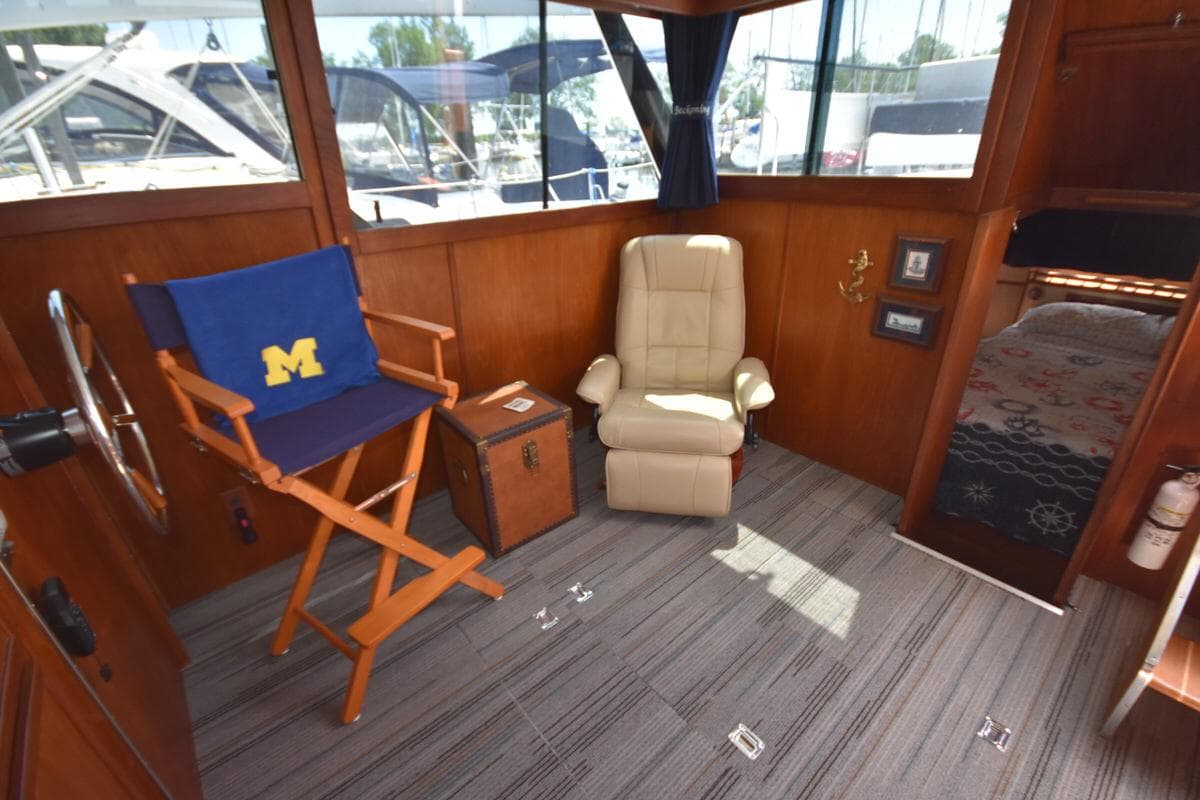 1985 Marinette 39 Double Cabin interior with chairs, nautical decor, and cabin view.