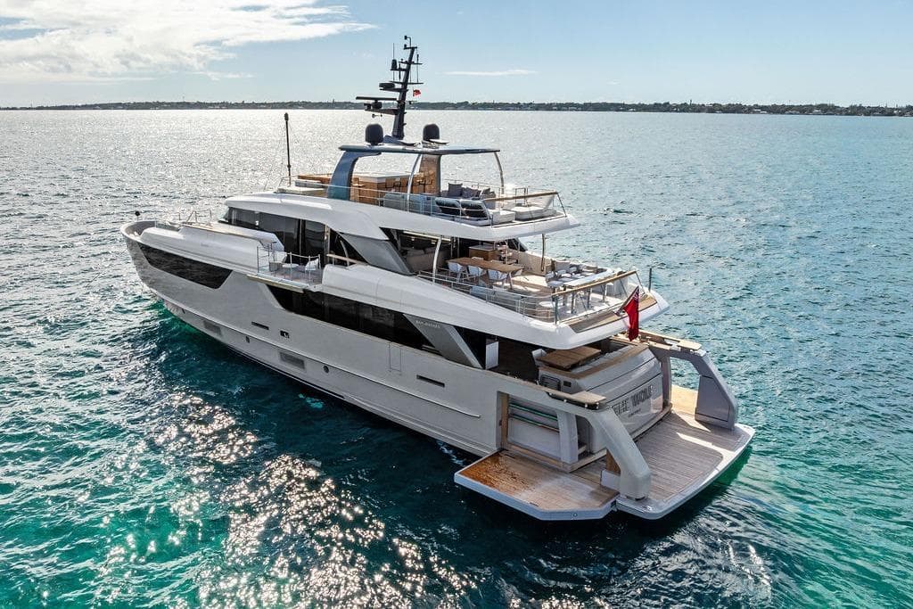 Luxurious 2023 Sanlorenzo SD118 yacht cruising on clear blue waters.