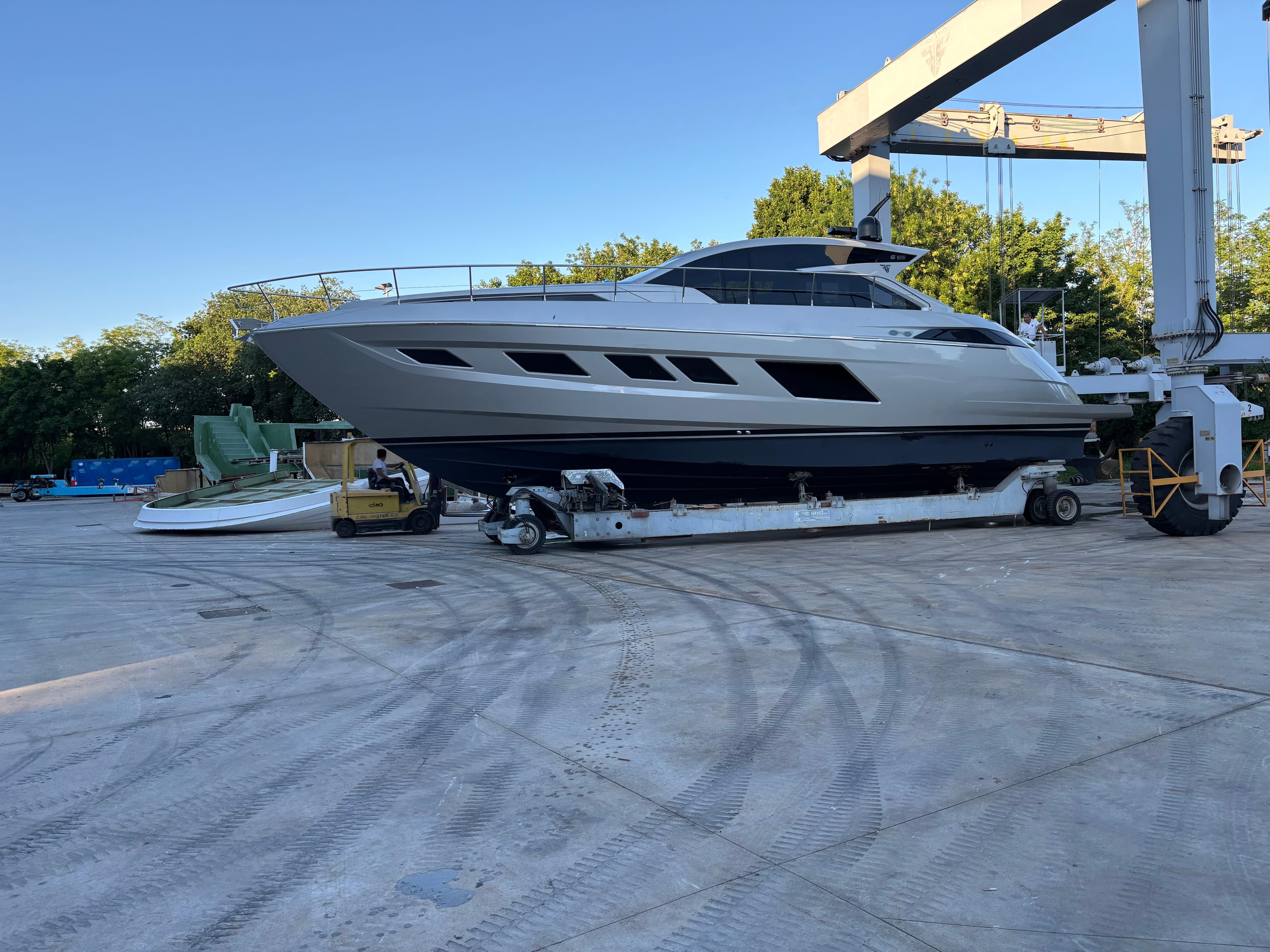 2025 Filippetti S55 yacht on a trailer in a shipyard setting.